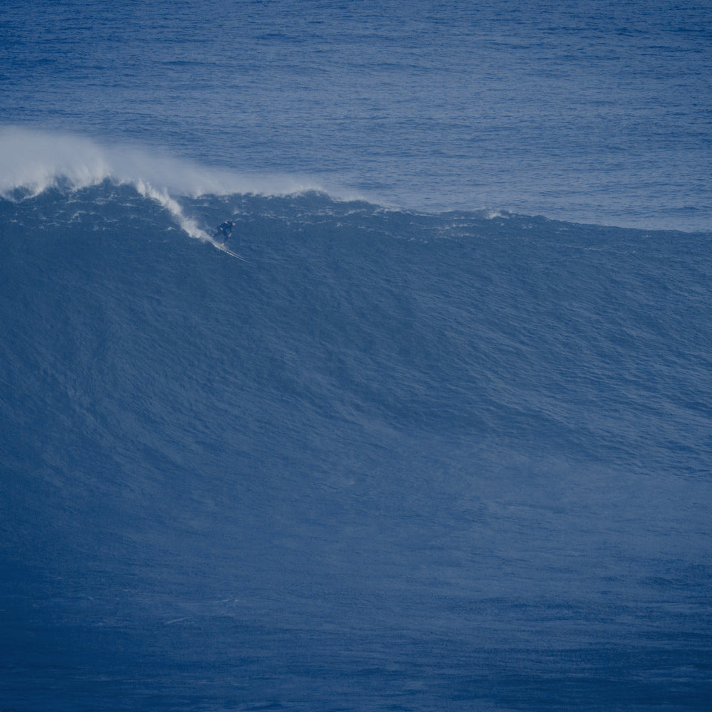 Tom Lowe [GR] with a Chris Christenson Gun at Nazaré a few years back