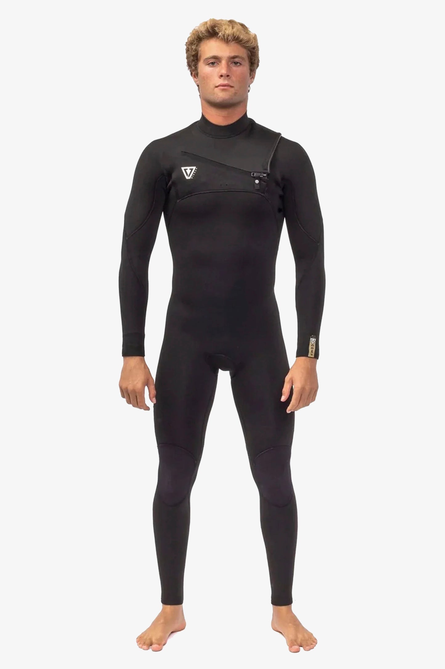 Person wearing a black Vissla wetsuit Pukas Surf Shop