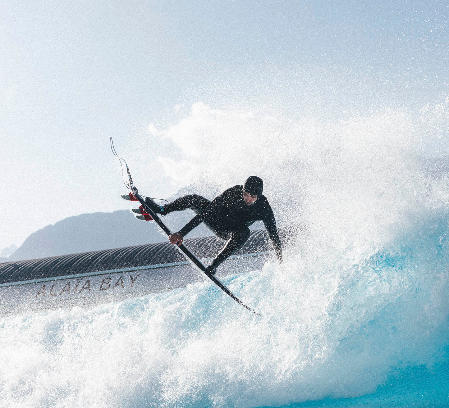 Person surfing on a wave in Alaïa Bay.