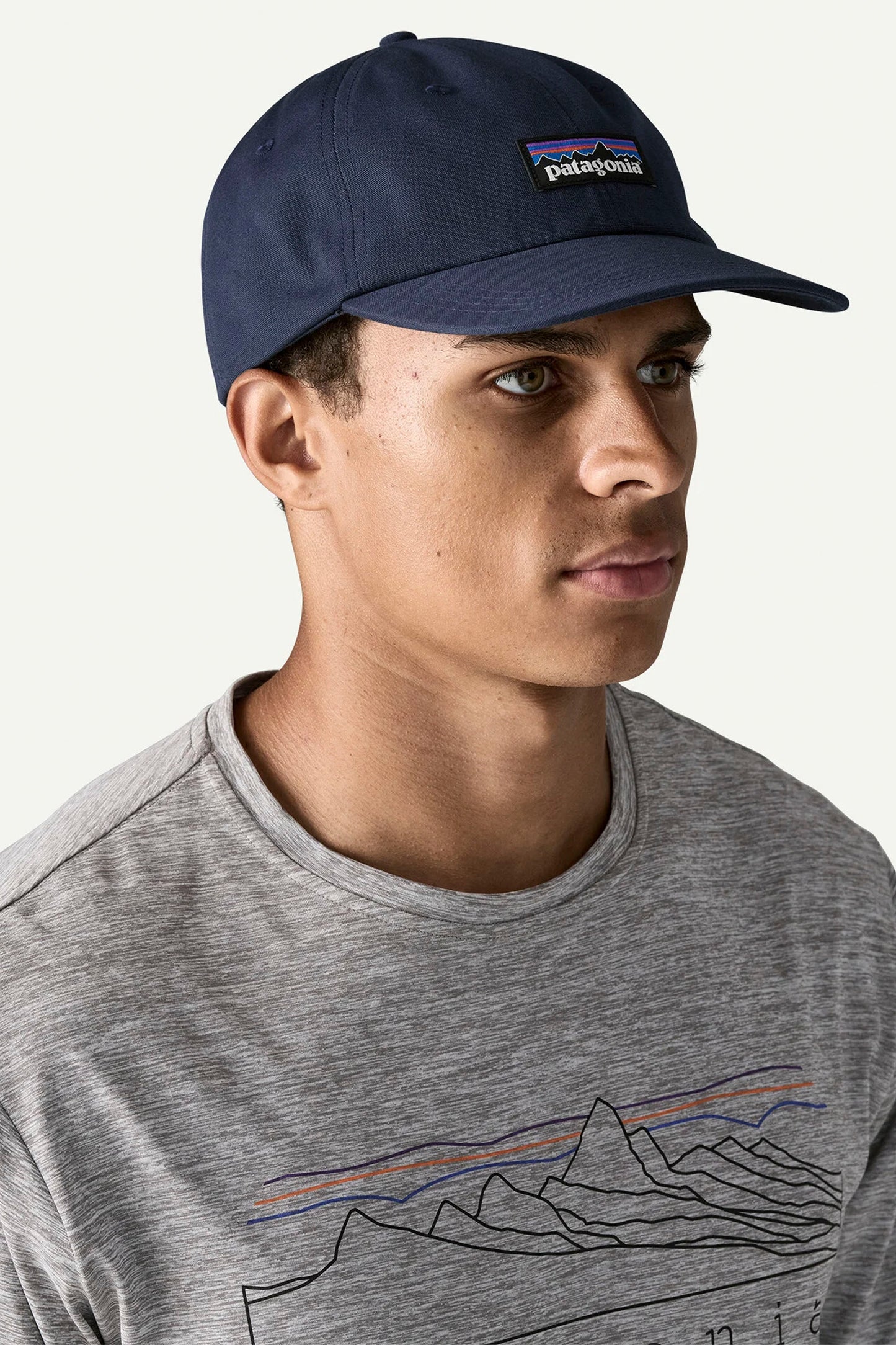 Man wearing a p-6 label trad cap in new navy colour