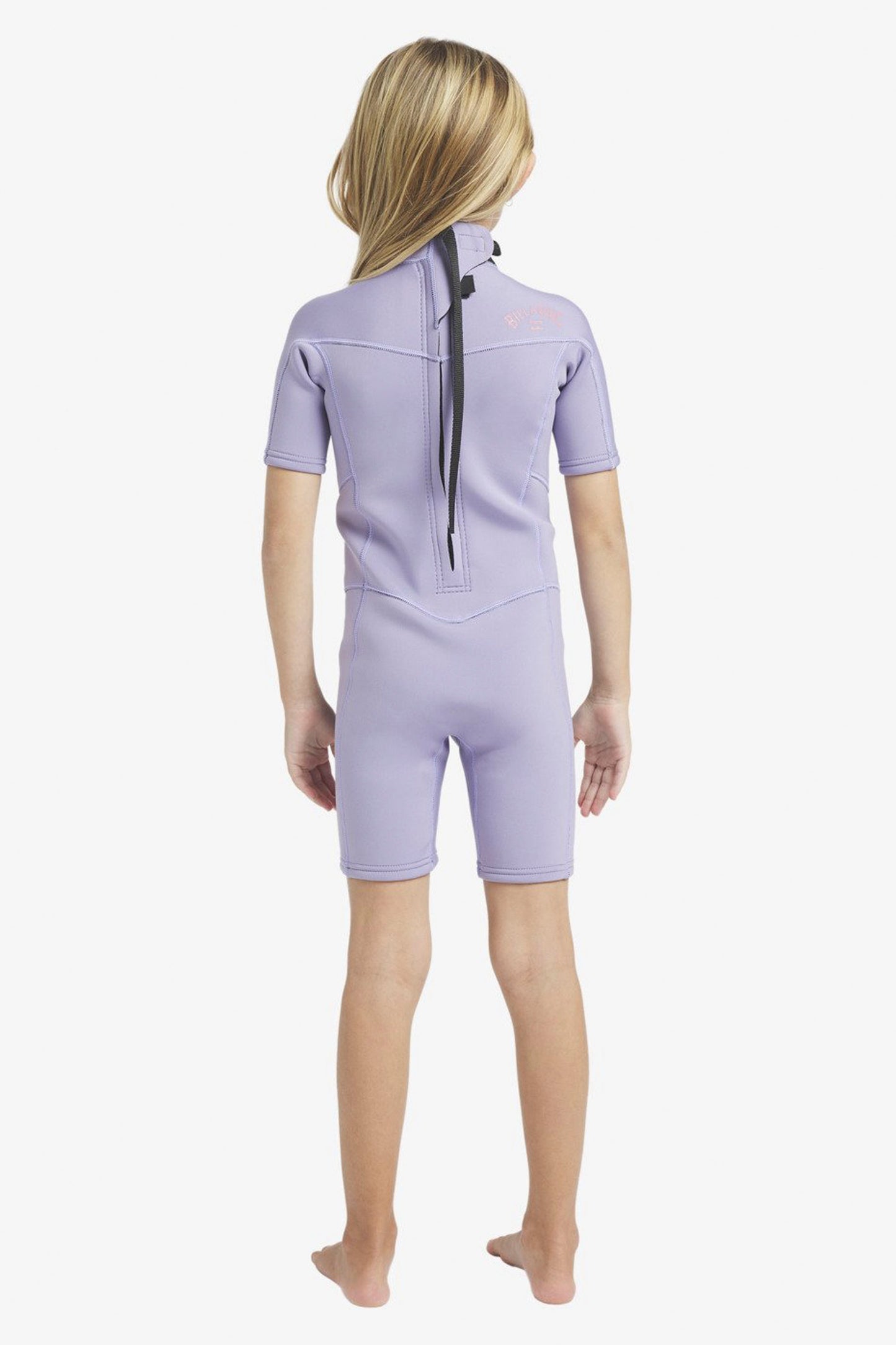 Child wearing a purple Billabong Absolute 2/2mm wetsuit on a white background