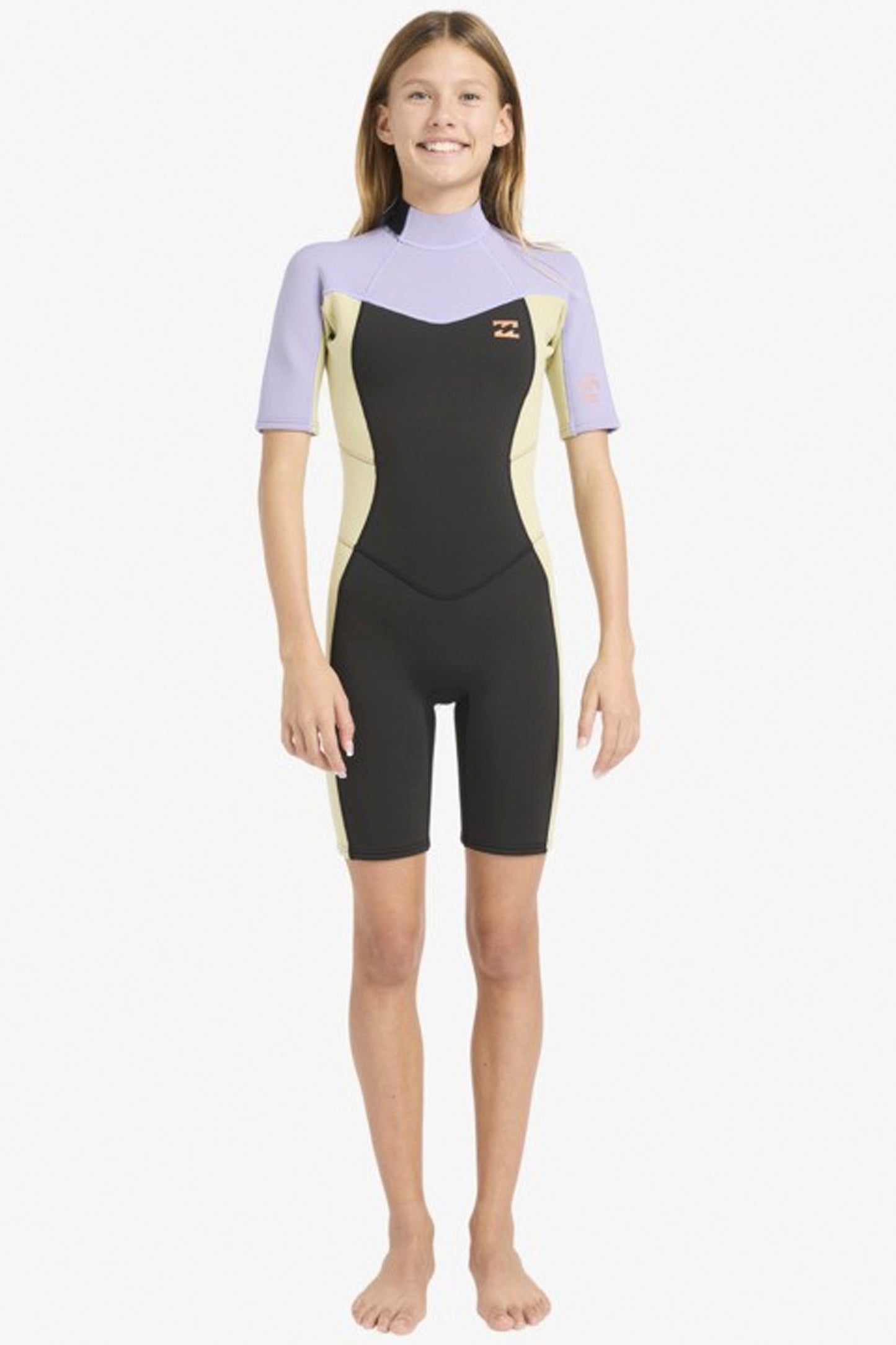 Teenager wearing a black and purple Billabong 2/2mm springsuit on a white background