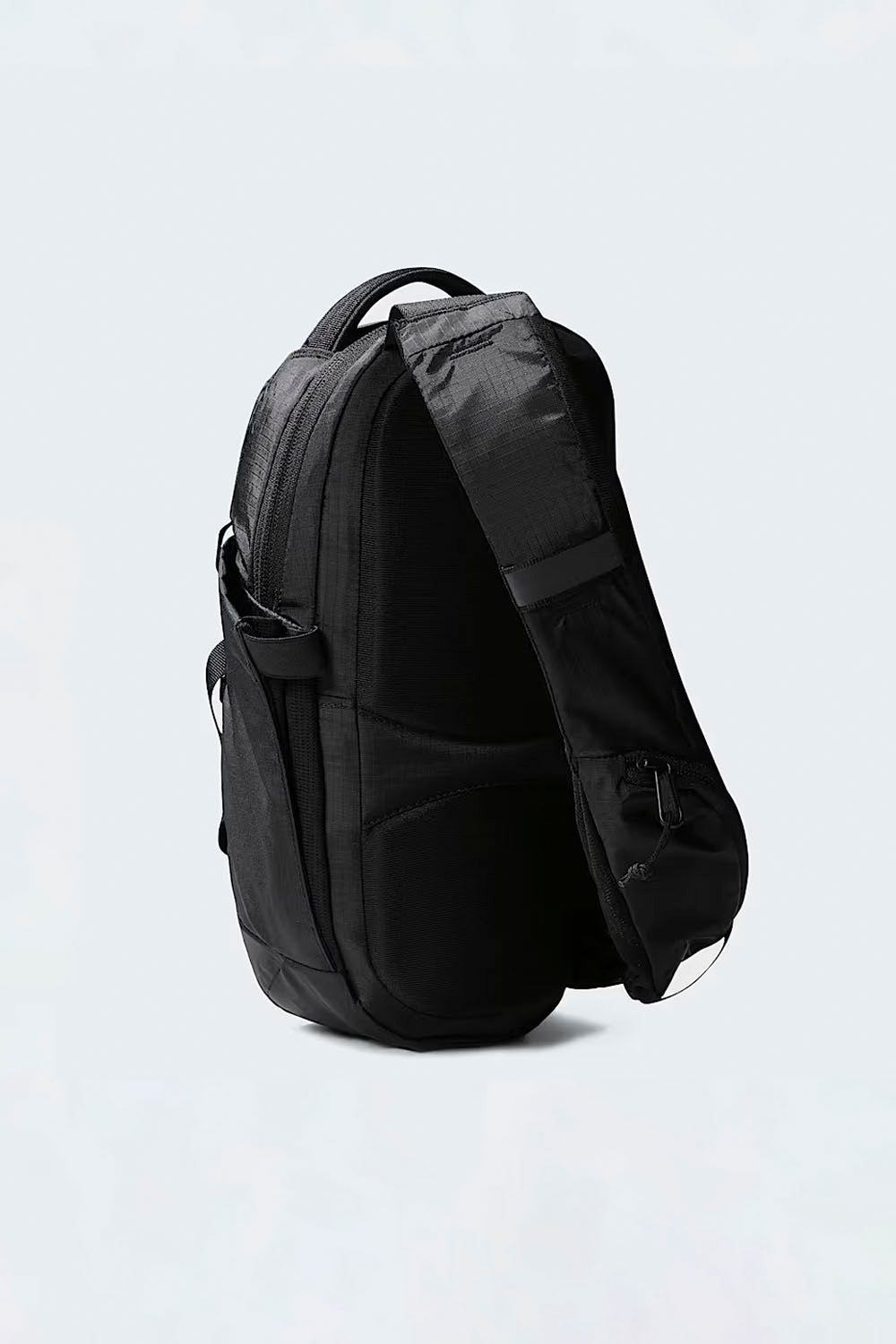 Black backpack on a light gray background