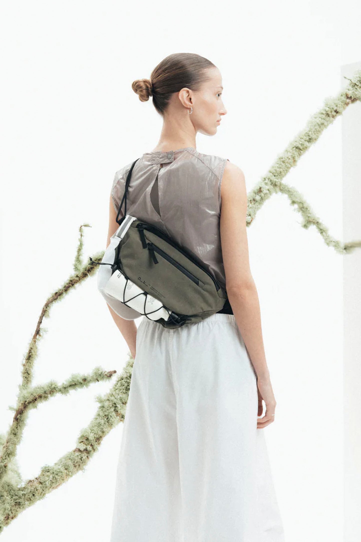 Db Roamer Pro Sling Bag 6L in Forest – technical ripstop cross-body sling with full-width opening, security pocket and reflective cord carry, available at Pukas Surf Shop