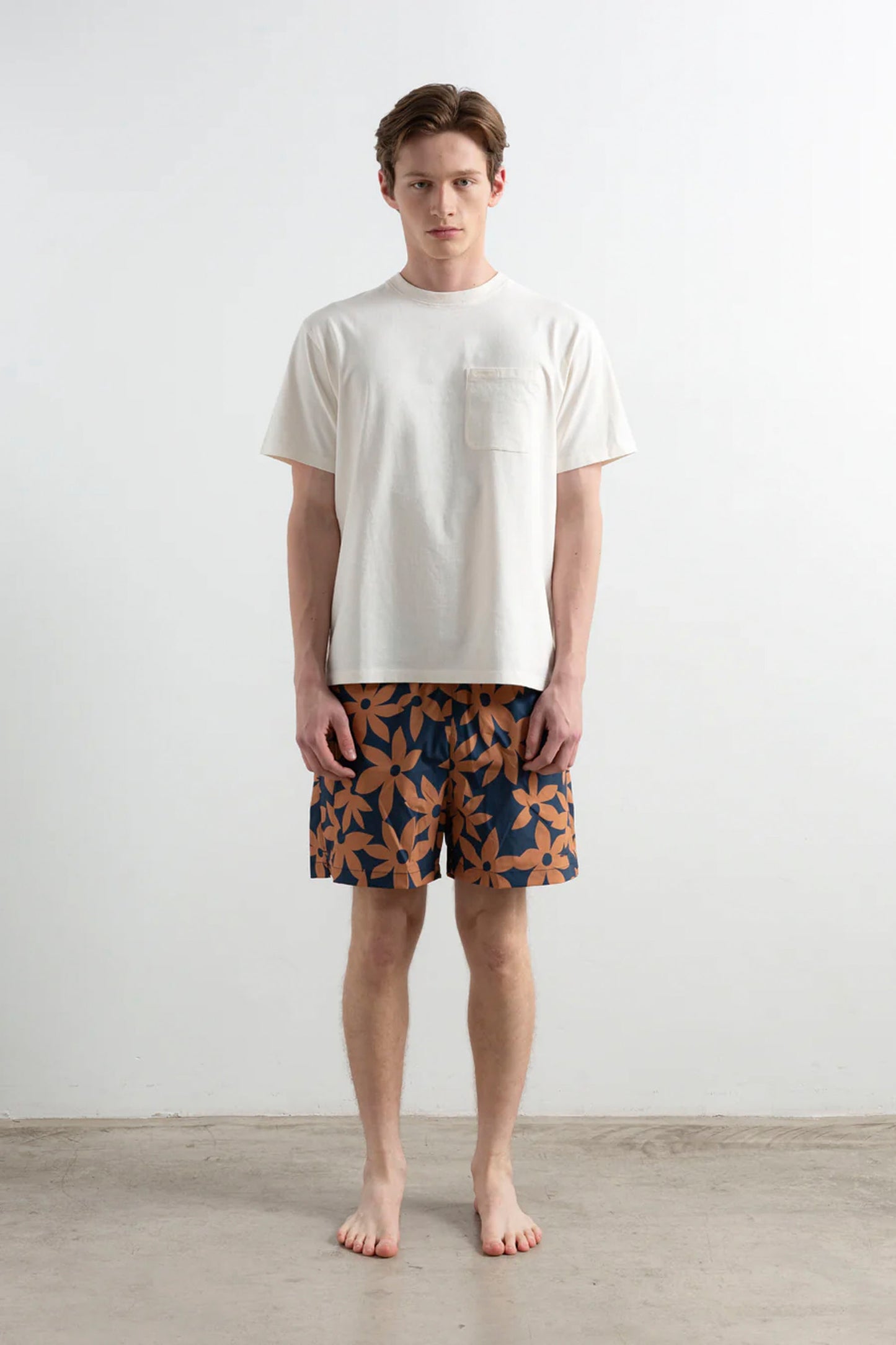 EDMMOND Lily Boardshort Plain Navy – Allover lily print boardshort with embroidered mini logo, front view