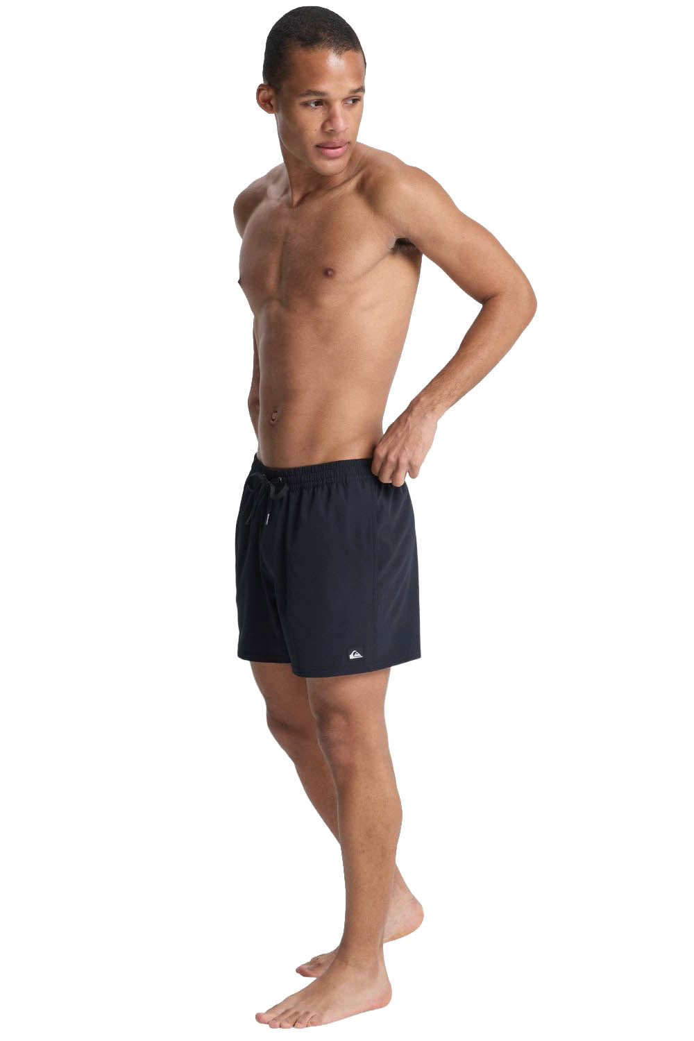 Man wearing black swim shorts on a white background