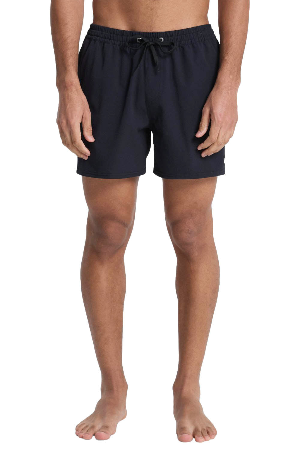 Person wearing navy blue swim shorts on a white background