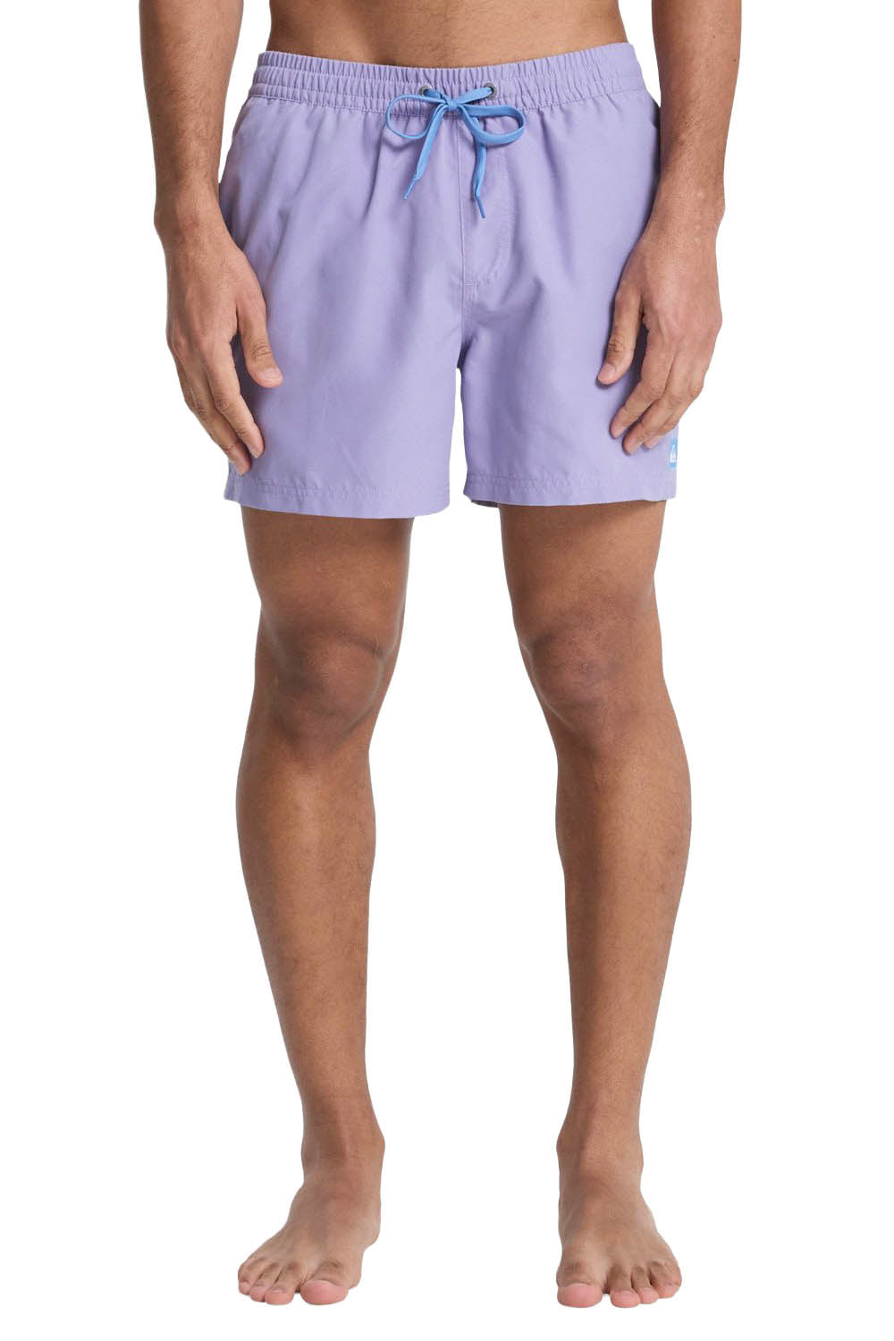 Person wearing light purple swim shorts on a white background