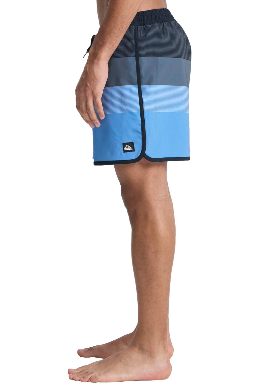 Blue and black striped shorts worn by a person on a white background