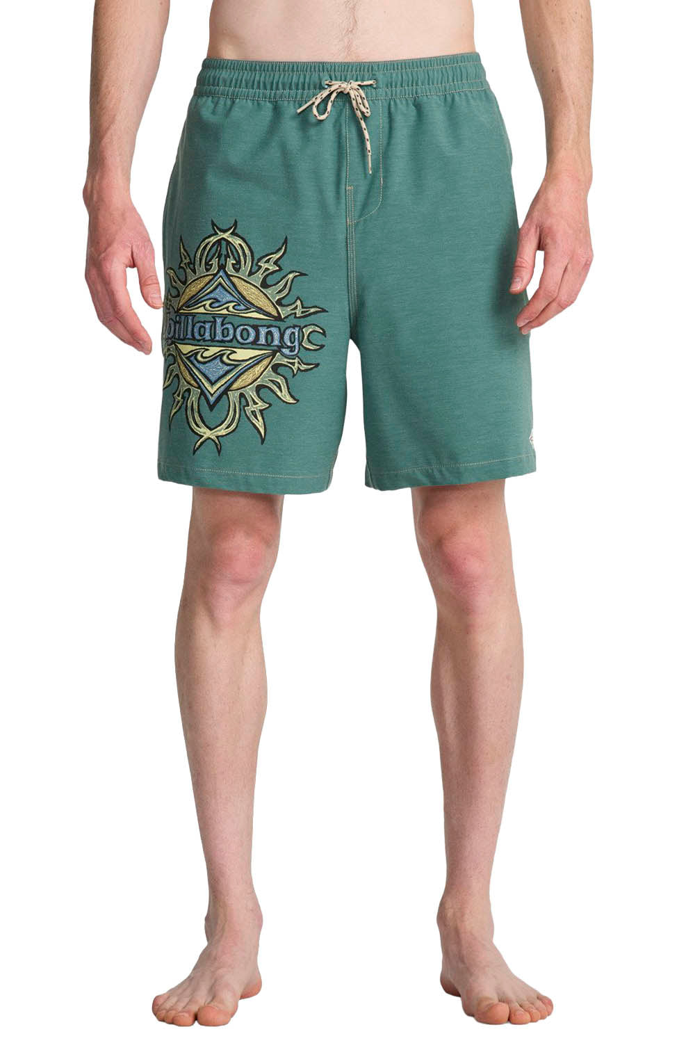 Green boardshorts with a Billabong logo on a white background