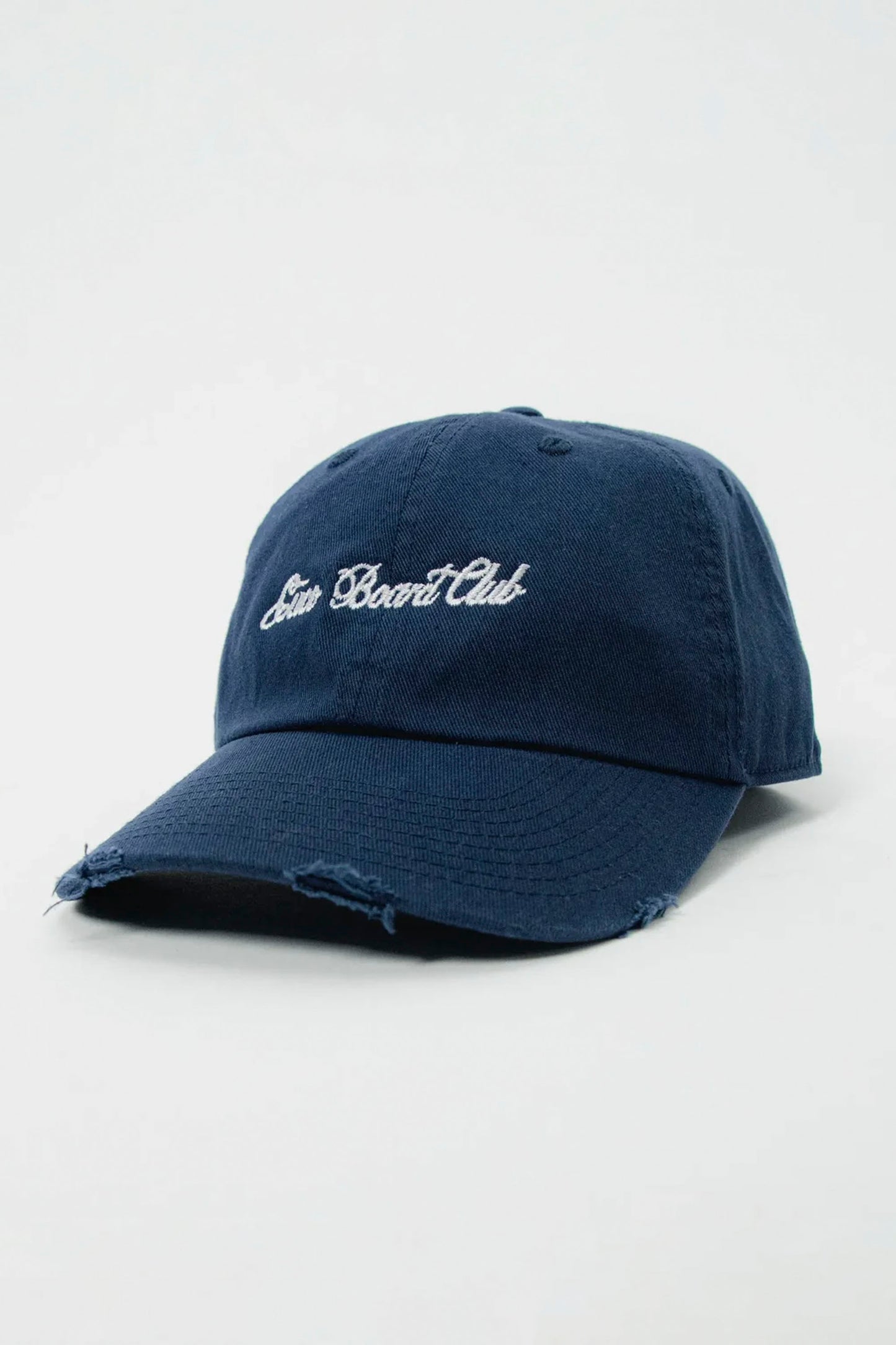 CUCO BOARD CLUB Script Low Profile Cap in Dark Ocean Navy - White embroidered signature on garment-washed cotton twill dad hat