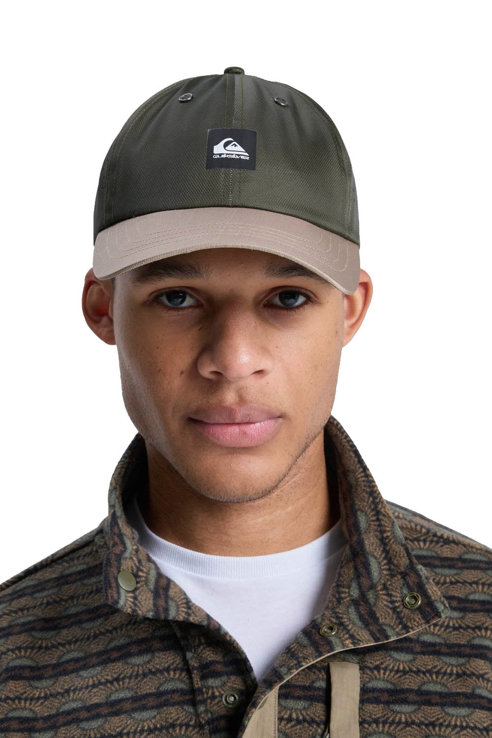Person wearing a green cap with a logo on a white background