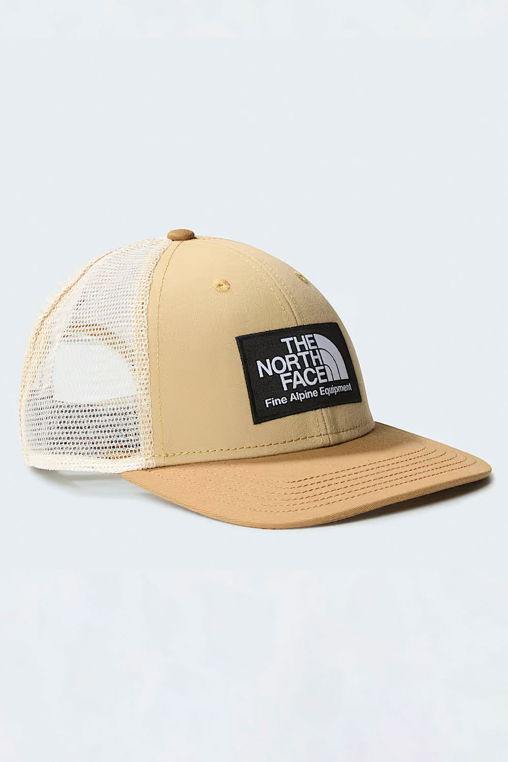 Beige mesh cap with The North Face logo on a light gray background