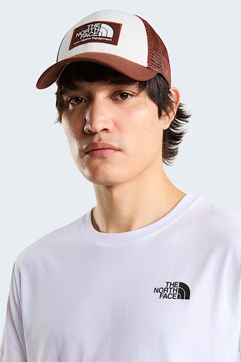 The North Face Mudder Trucker Cap in Ember Soil and White — structured trucker hat for surf and outdoor lifestyle