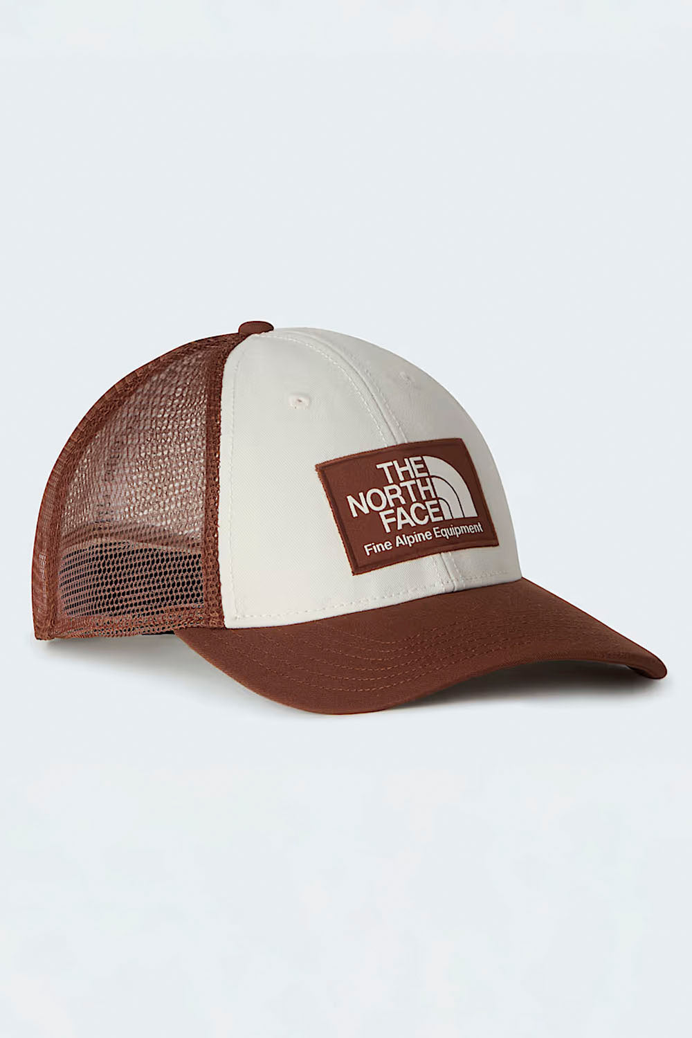 The North Face Mudder Trucker Cap in Ember Soil and White — structured trucker hat for surf and outdoor lifestyle