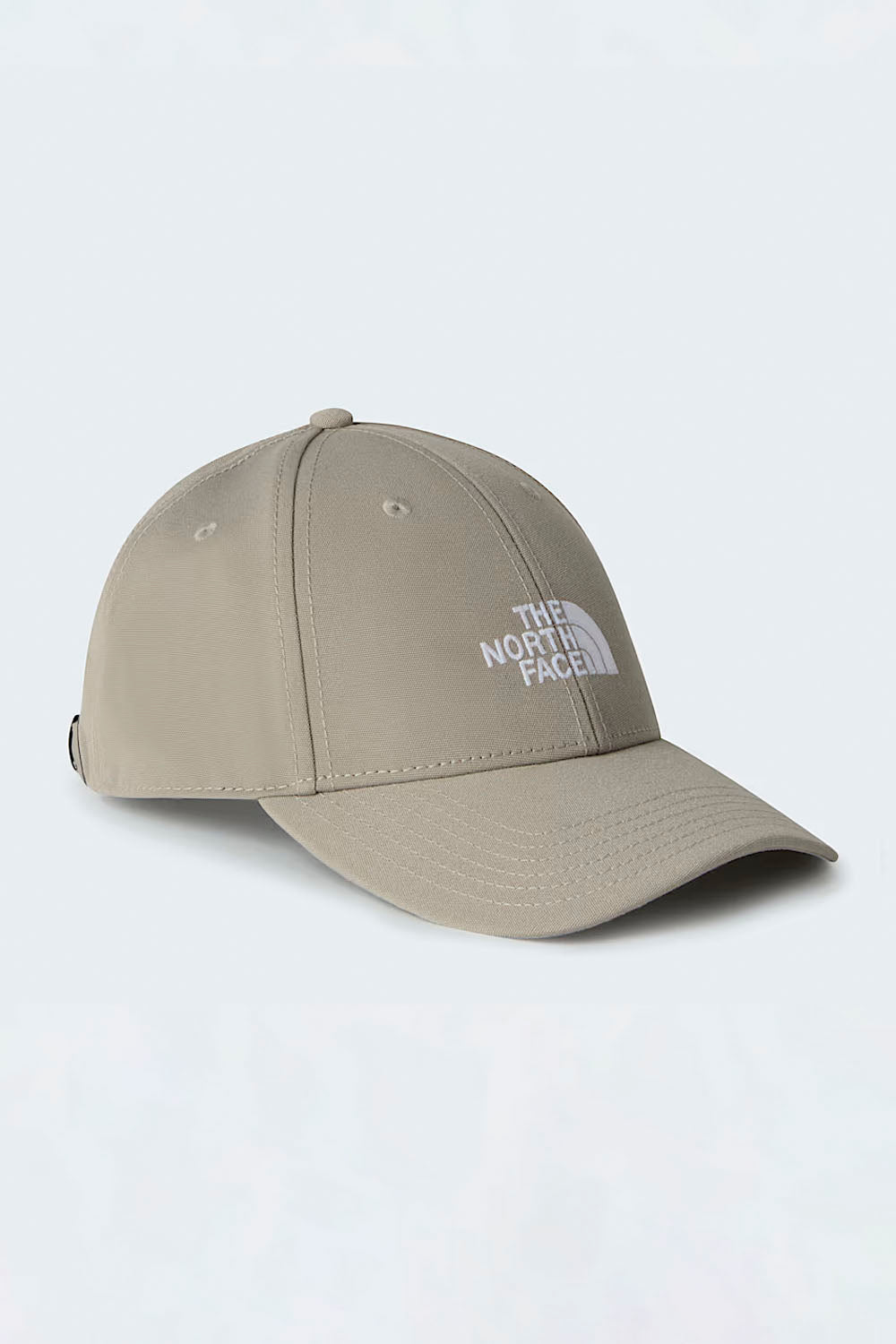 Beige cap with 'The North Face' logo on a light gray background