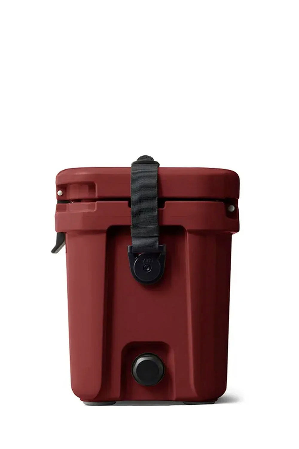The bottom view of a YETI cooler in a deep red color, showing the embossed YETI logo, four gray corner protectors, and black latches on a white background.