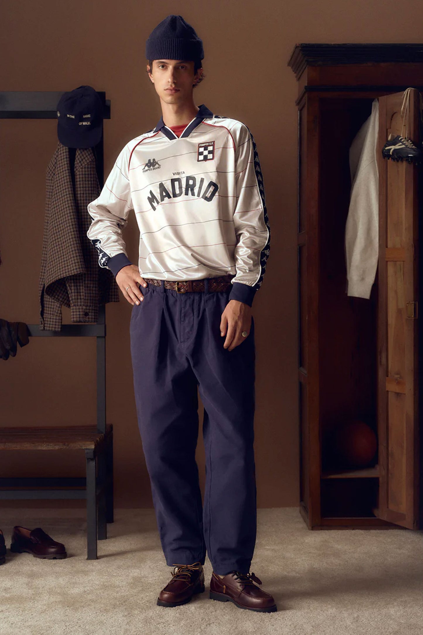 Person wearing a vintage Madrid sports jersey with Pompeii leather shoes Pukas Surf Shop