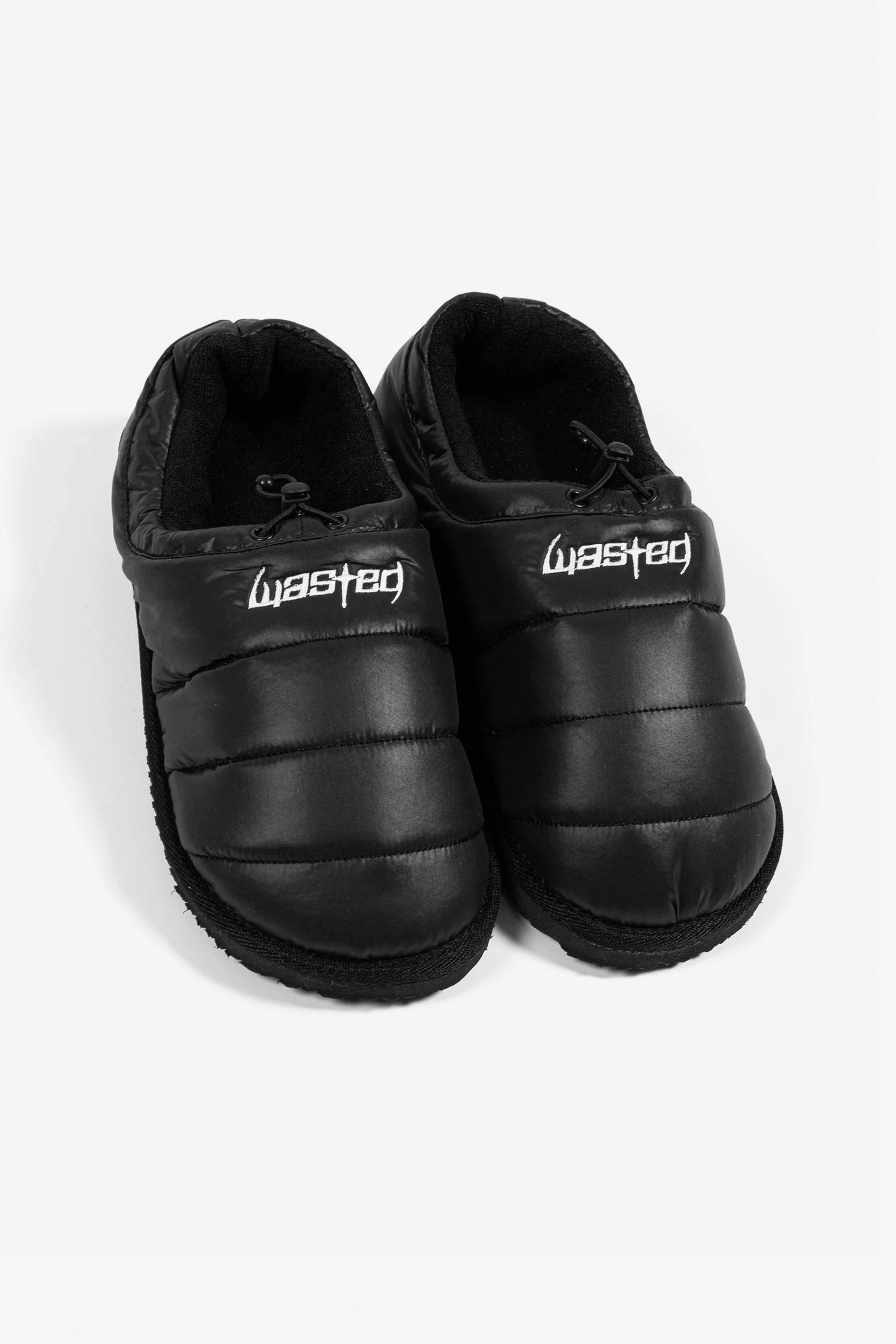 Pair of black slippers with 'Wasted Paris' branding Pukas Surf Shop