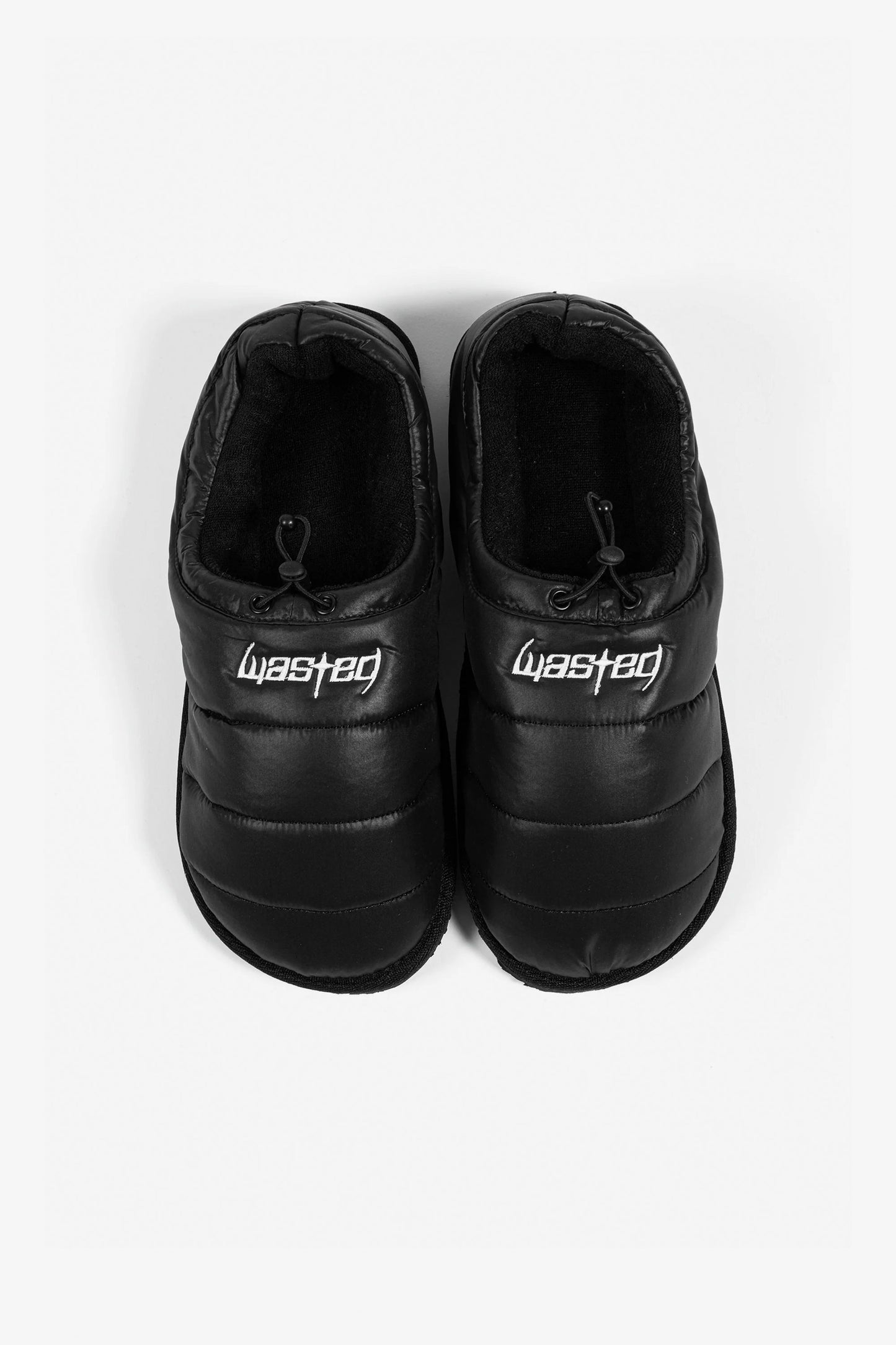 Pair of black slippers with 'Wasted Paris' branding Pukas Surf Shop