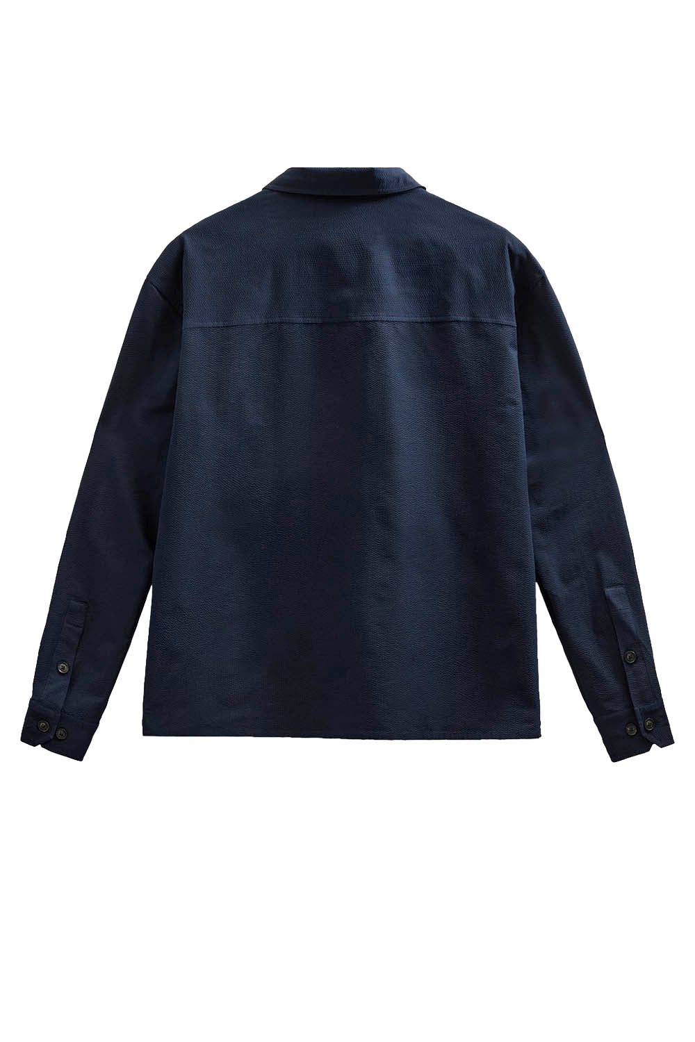 A dark navy blue long-sleeve shirt jacket shown from the back, featuring a collar and a horizontal seam across the upper back, set against a plain white background.