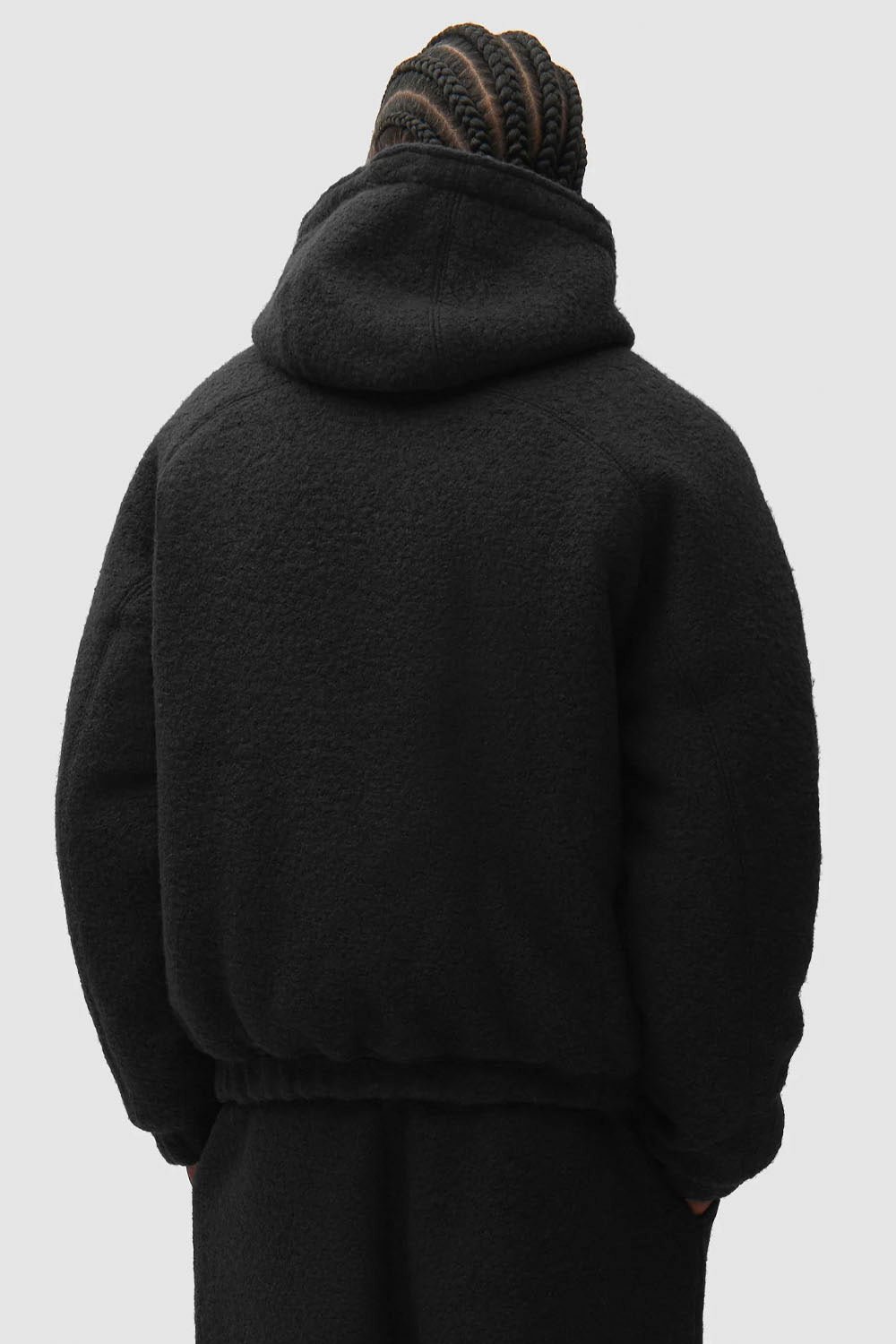 “ARTE Boiled Wool Hooded Jacket in black with front zip, drawstring hood and patch pockets