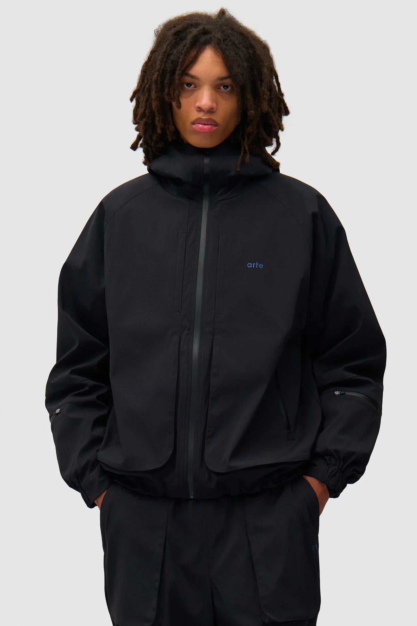 Pukas Surf Shop Arte Antwerp reversible technical polar jacket black water-repellent inner fleece drawcord hem