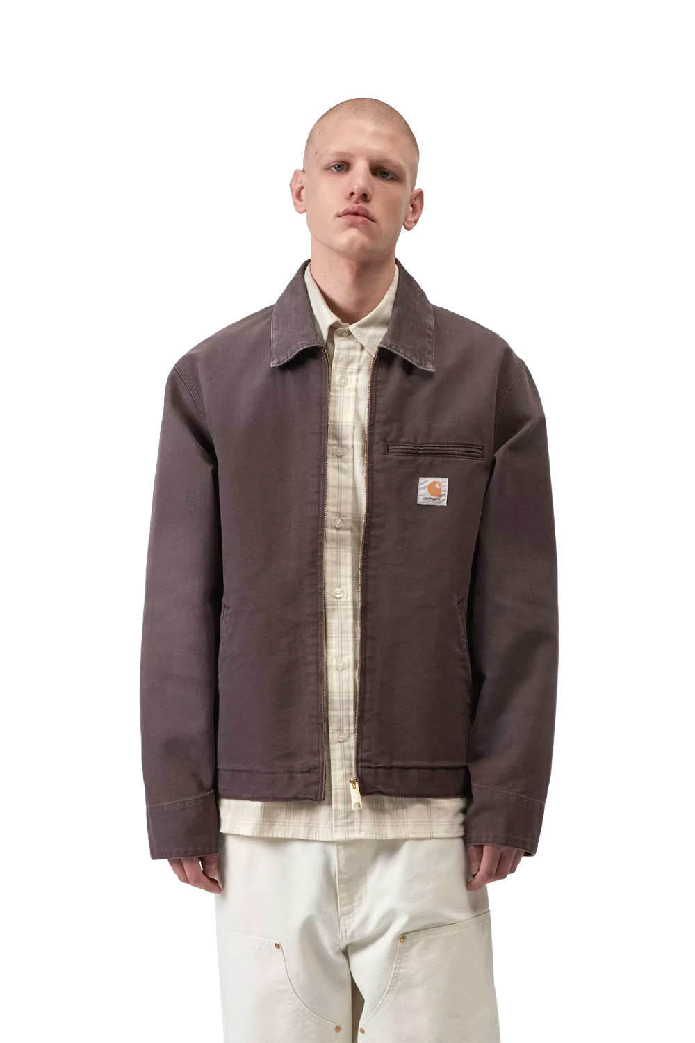 Man wearing a brown jacket over a white shirt and pants on a white background