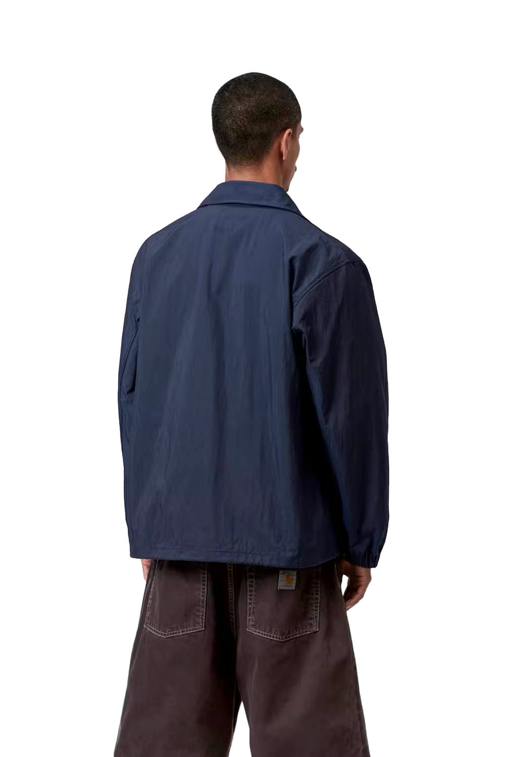 Person wearing a blue jacket on a white background