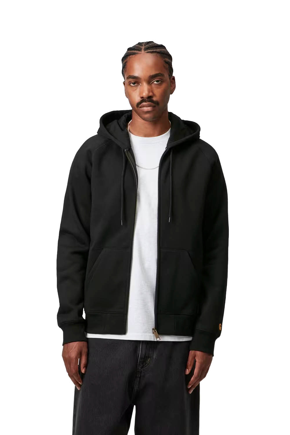 Man wearing a black hooded jacket over a white shirt on a white background