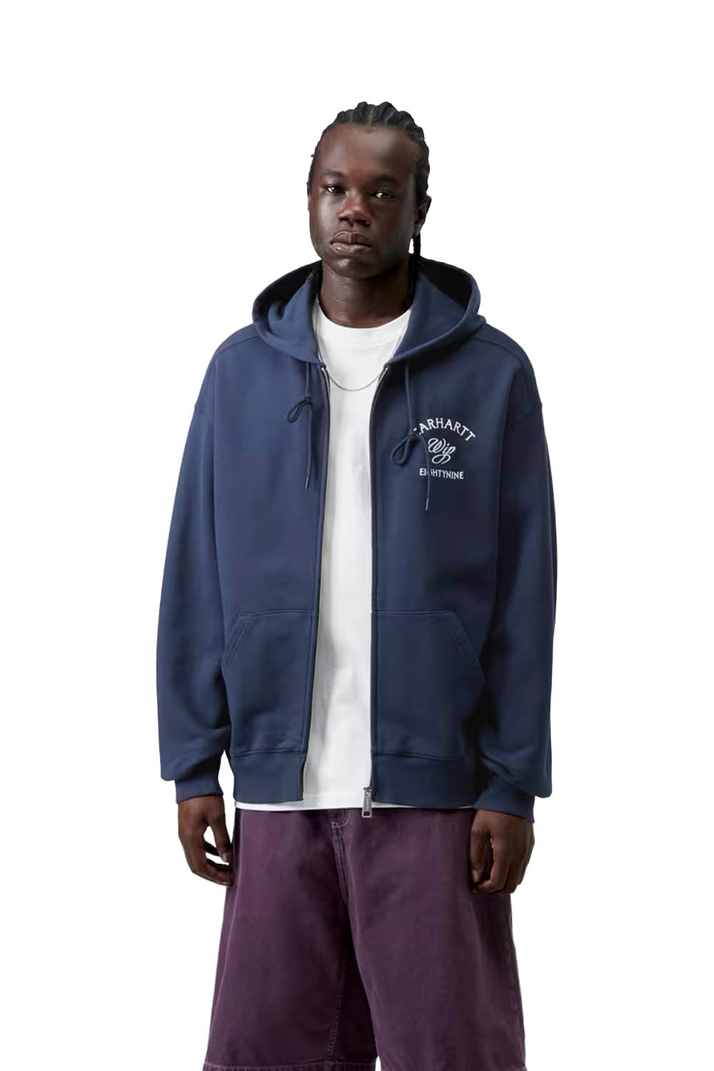 Person wearing a navy blue hoodie with a brand logo on a white background