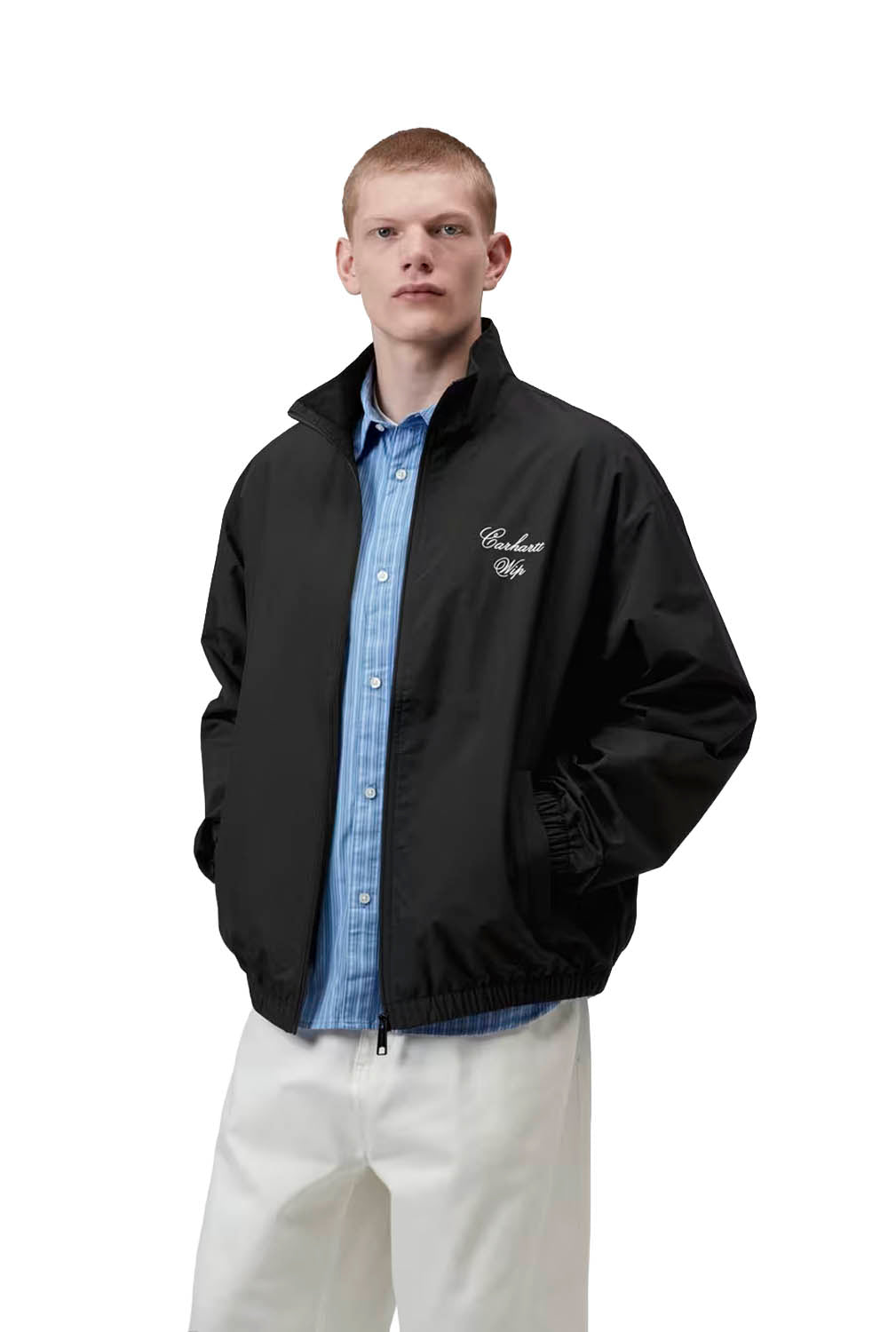Man wearing a black jacket with a logo on a white background