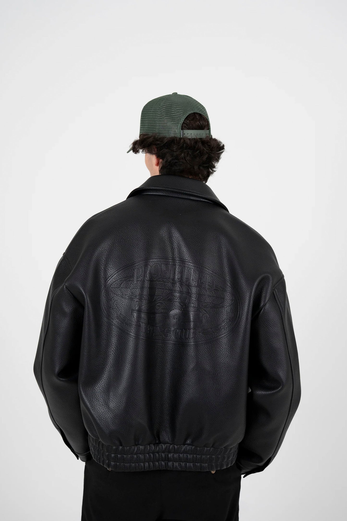 Man wearing PROHIBITED Speedhunter bomber jacket in black - back view