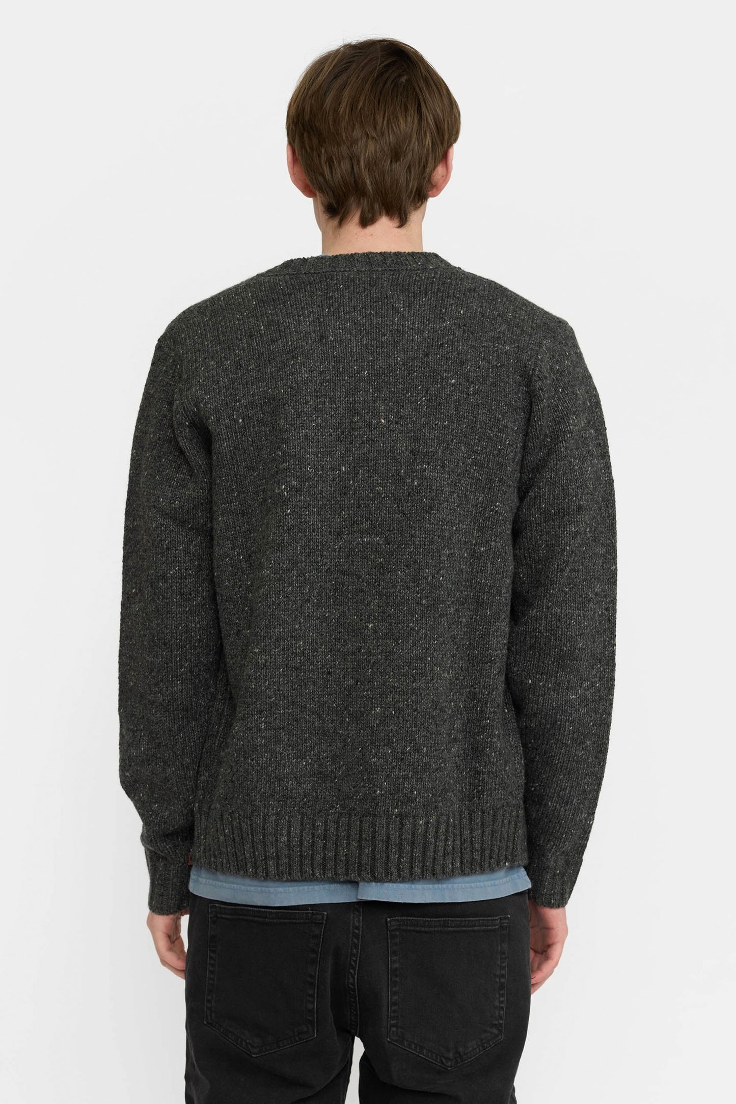 Revolution dark gray cardigan over a blue shirt Pukas Surf Shop