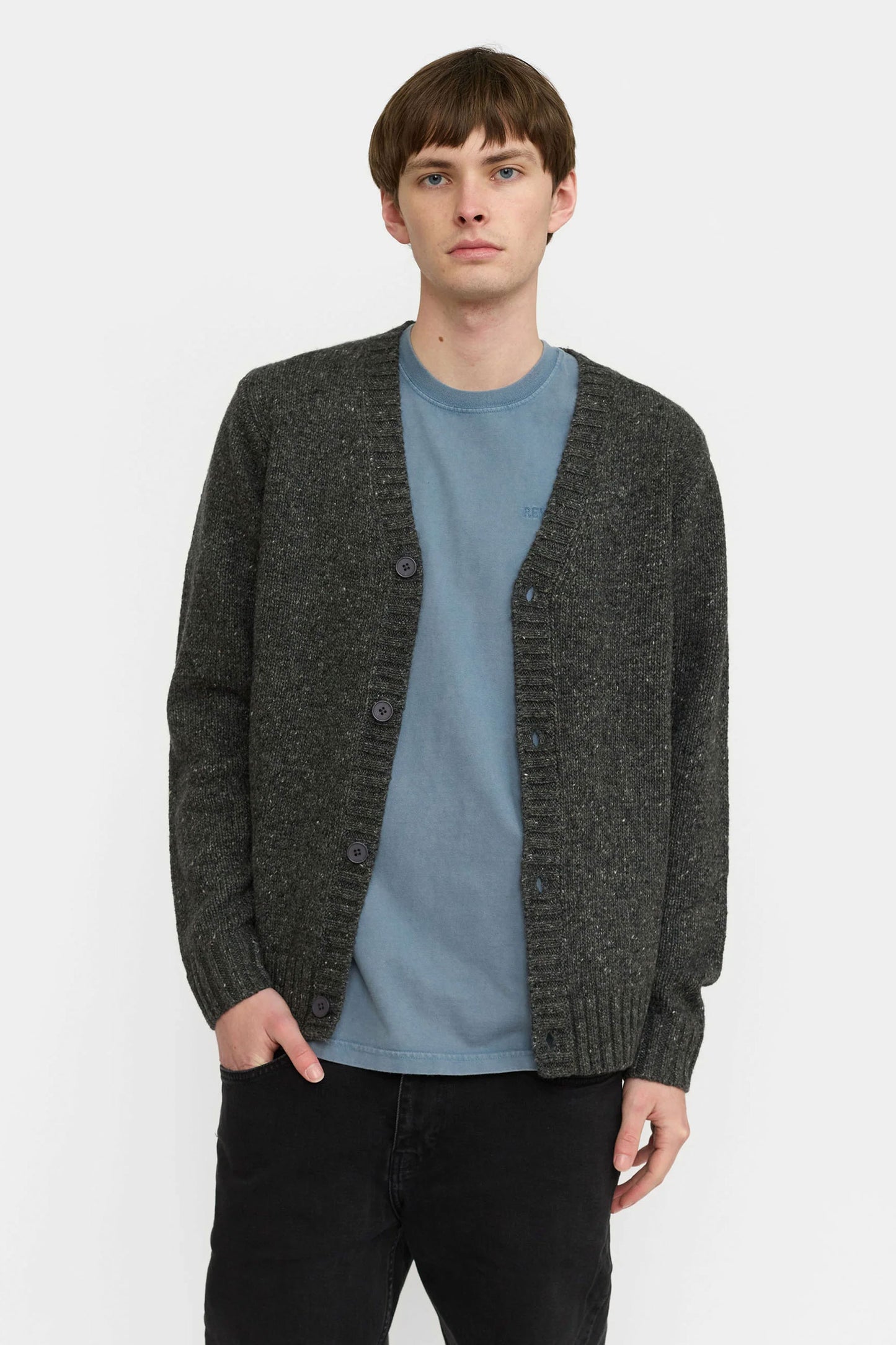 Revolution dark gray cardigan over a blue shirt Pukas Surf Shop