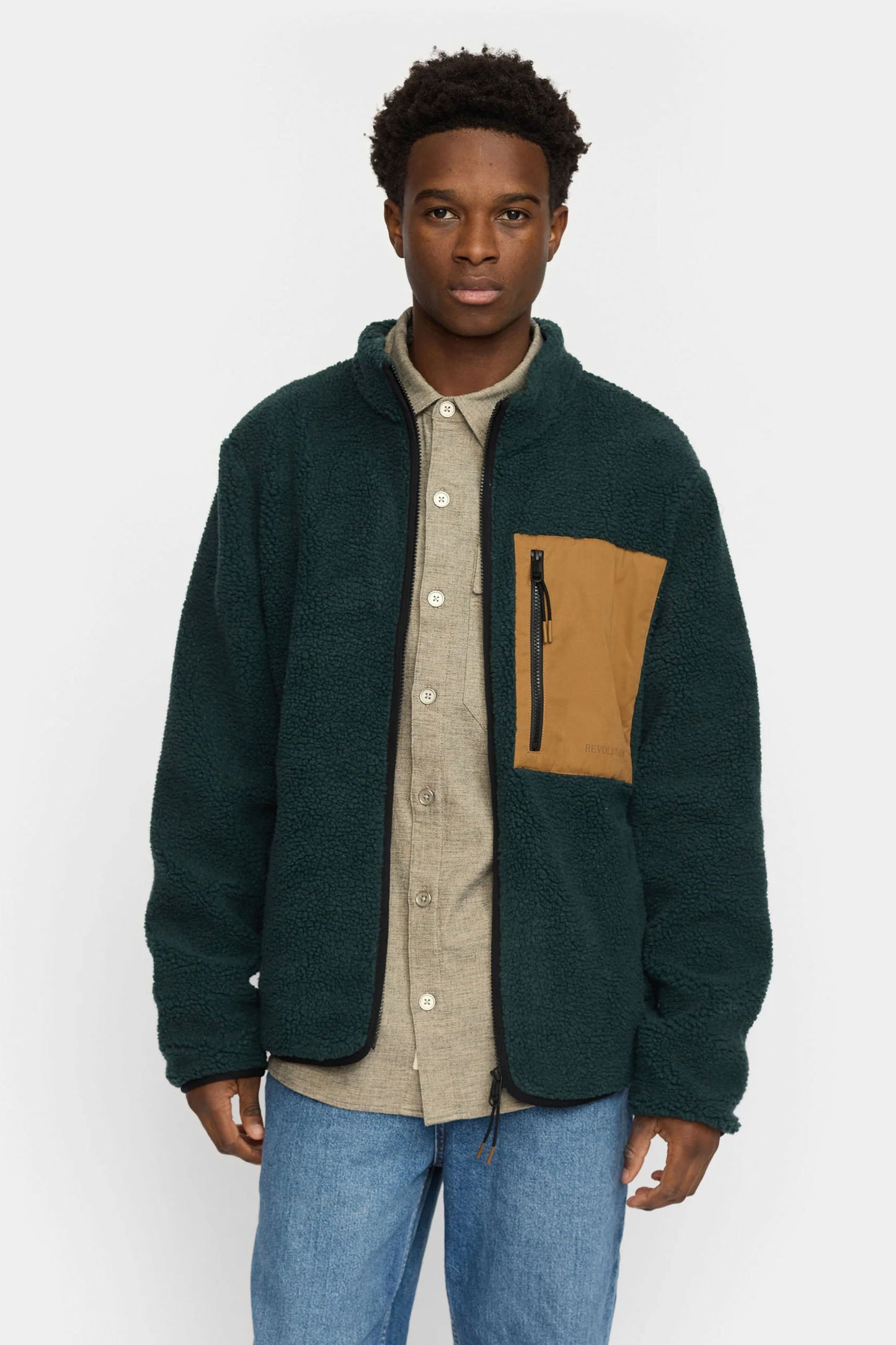 Revolution dark green jacket with a brown patch Pukas Surf Shop