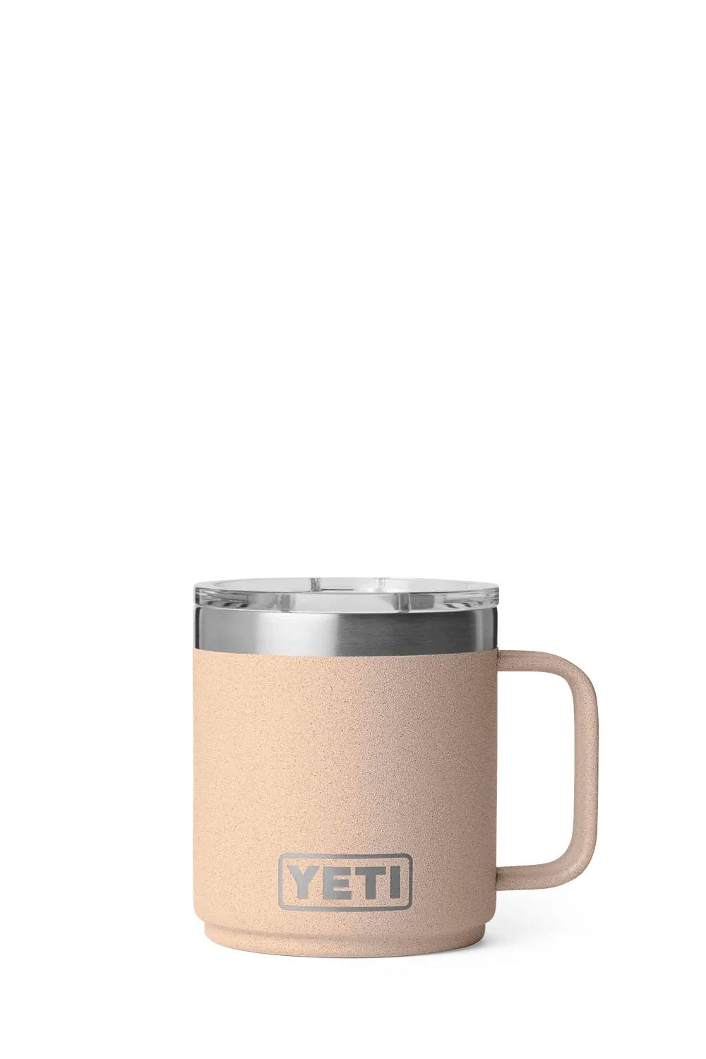 A YETI insulated travel mug in a textured light beige color, featuring a clear lid with a white silicone seal and a matching beige handle, shown on a solid white background.