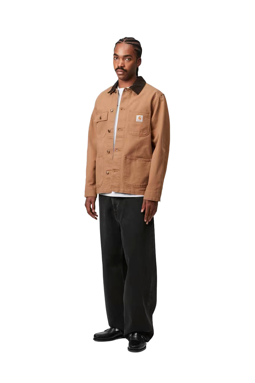 Man wearing a brown jacket, white shirt, black pants, and black shoes on a white background