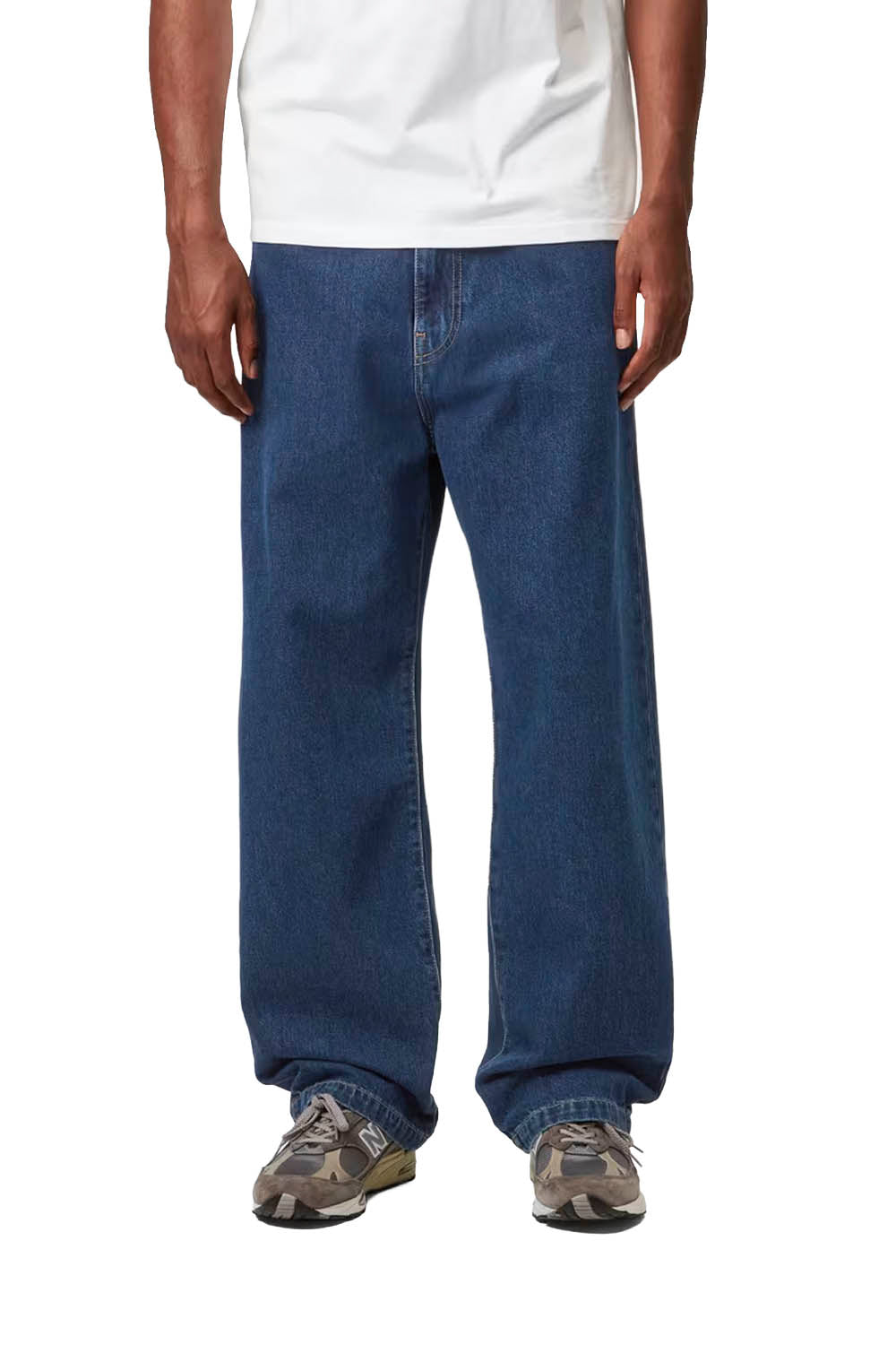 Man wearing a white Carhartt t-shirt and blue jeans on a white background