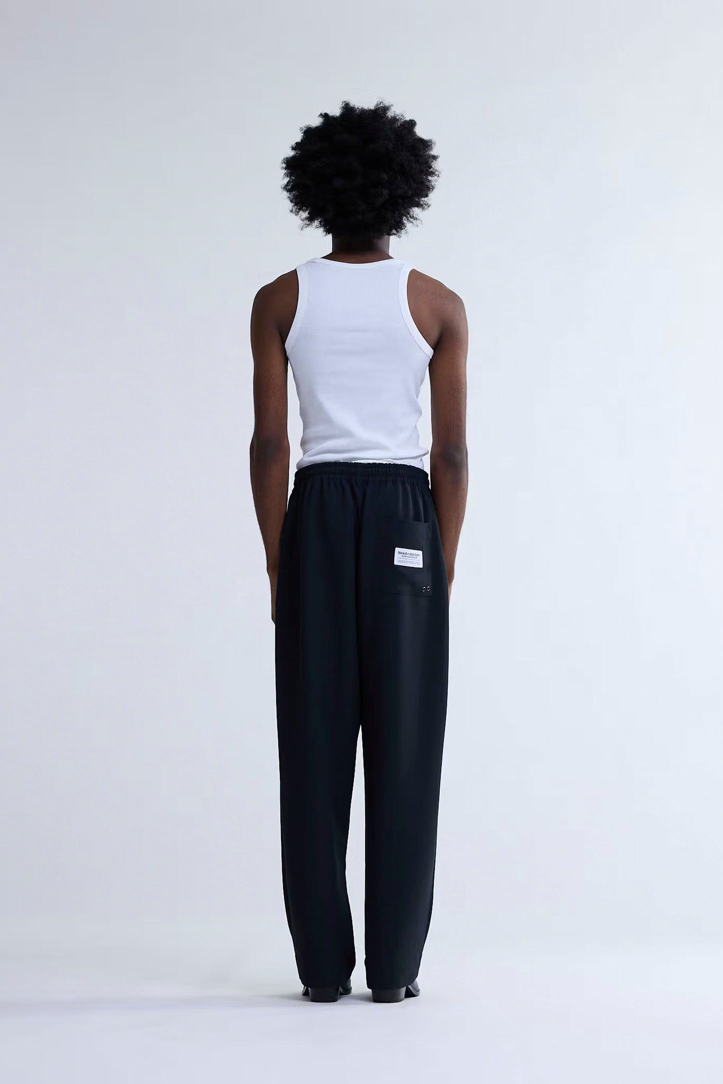 New Amsterdam Surf Association Work Trousers black back view showing patch pocket with woven label and straight leg cut