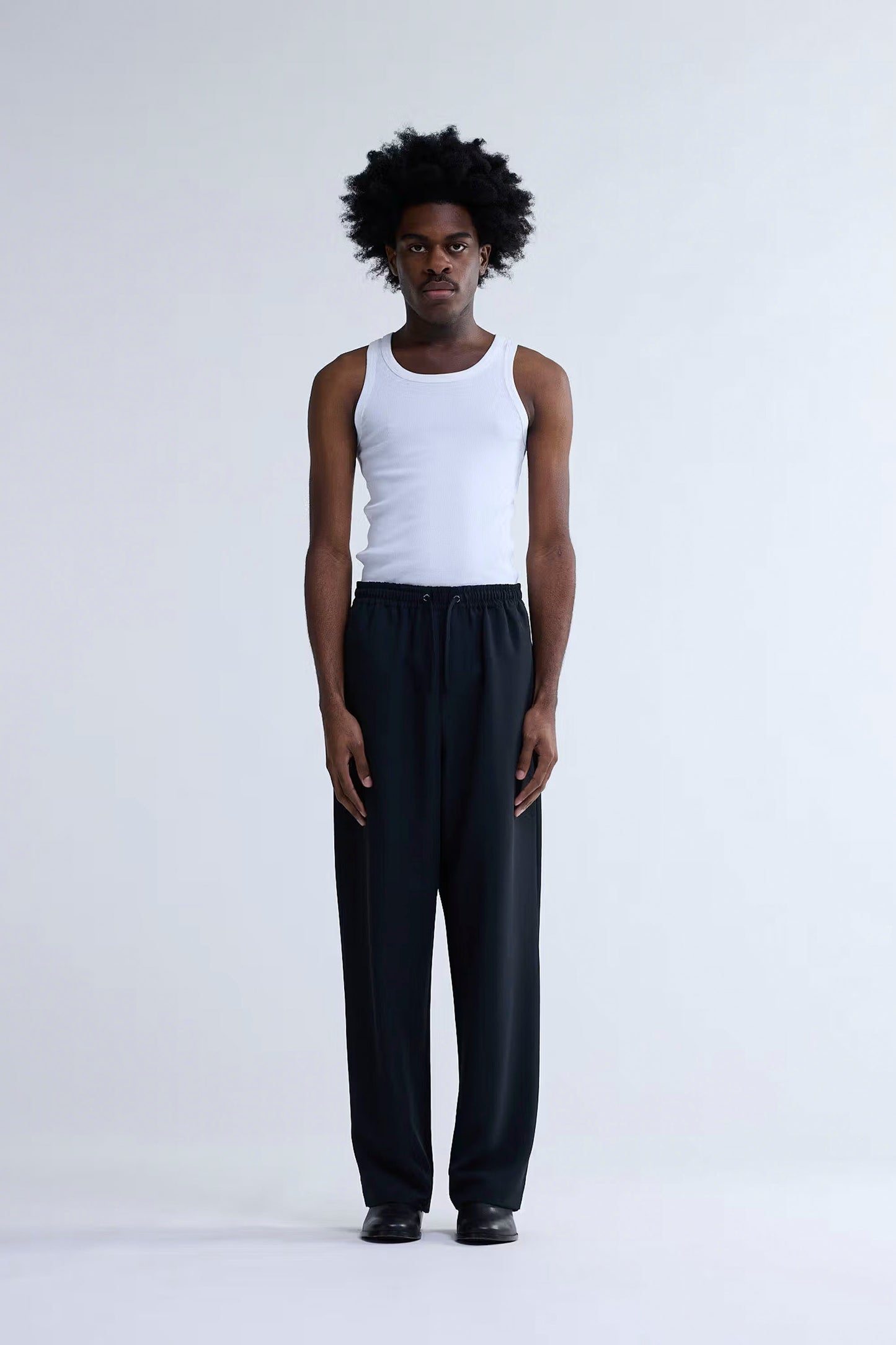 New Amsterdam Surf Association Work Trousers black relaxed fit front view with elasticated waistband and drawcords