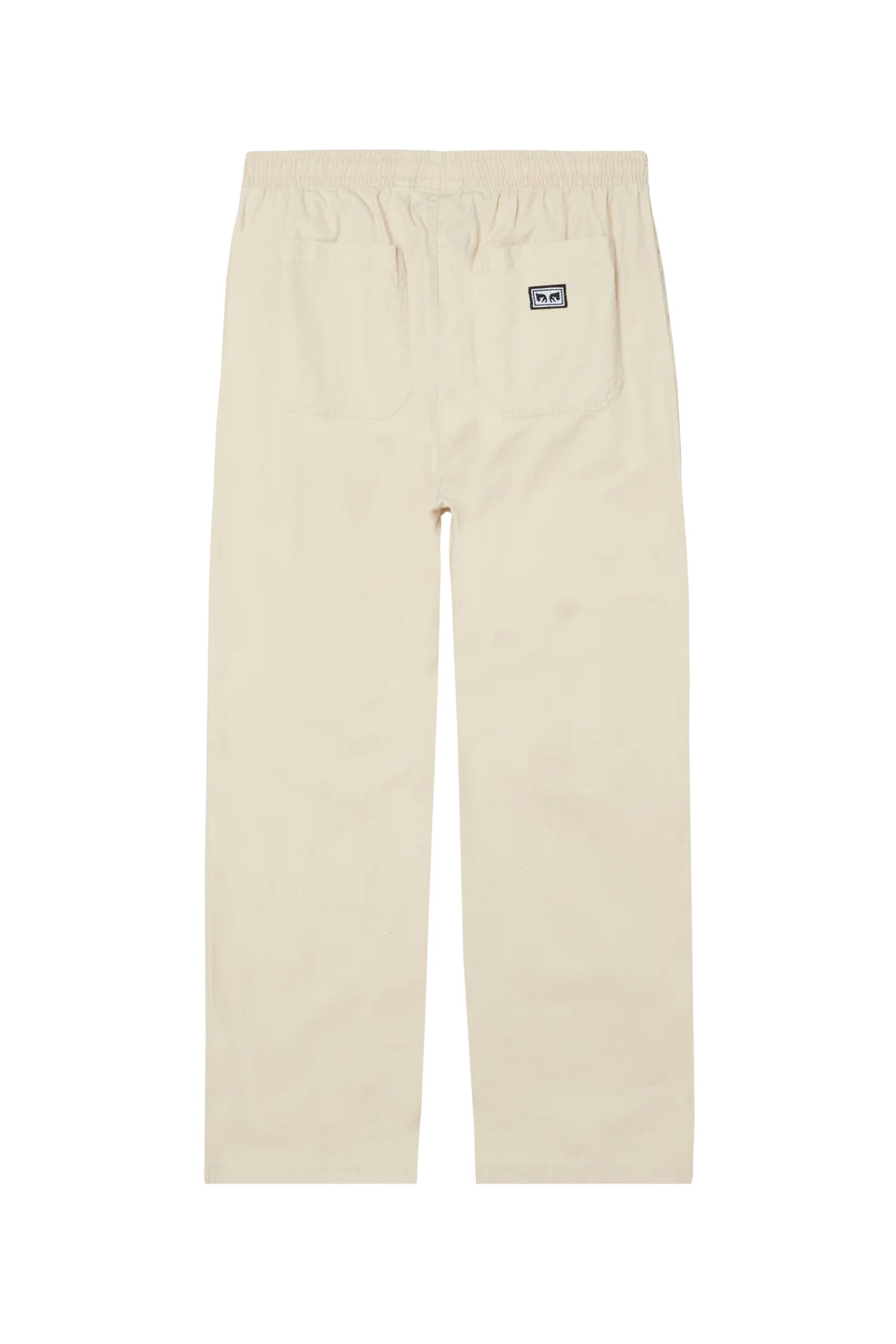  Beige OBEY Theo Easy pants with a small logo on a white background