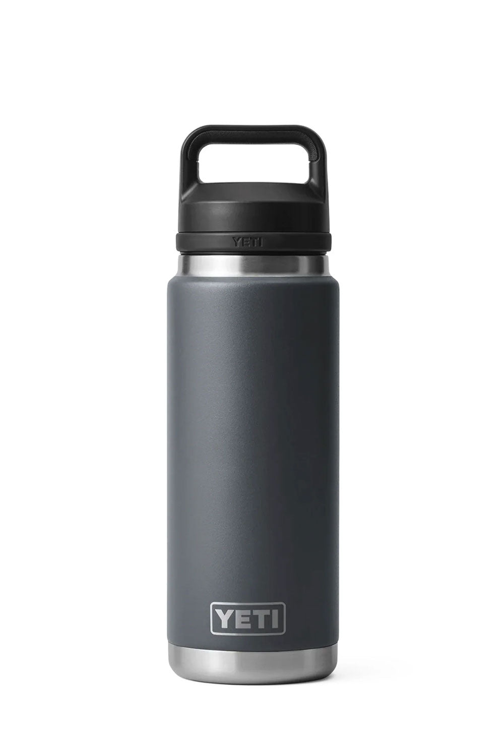 A YETI insulated water bottle with a matte dark gray body, a black lid with a carrying handle, and a silver stainless steel base, shown on a plain white background.