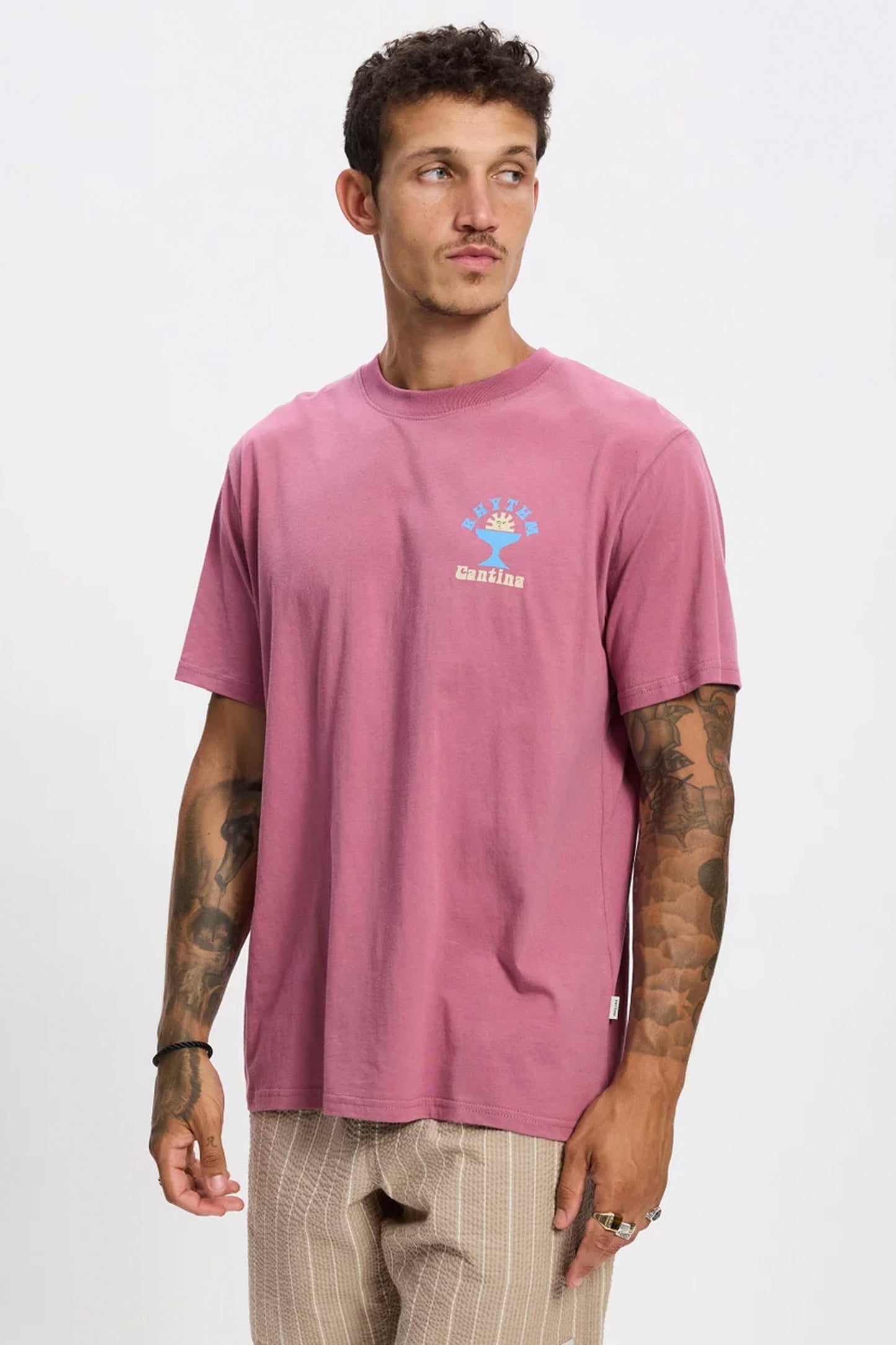 Man wearing Rhythm Cantina tee in fig - lifestyle shot showcasing dropped shoulders and relaxed fit