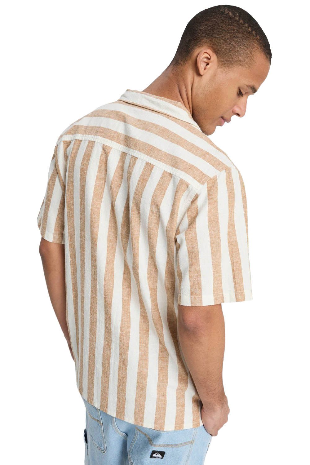 Man wearing a beige and white striped shirt on a white background