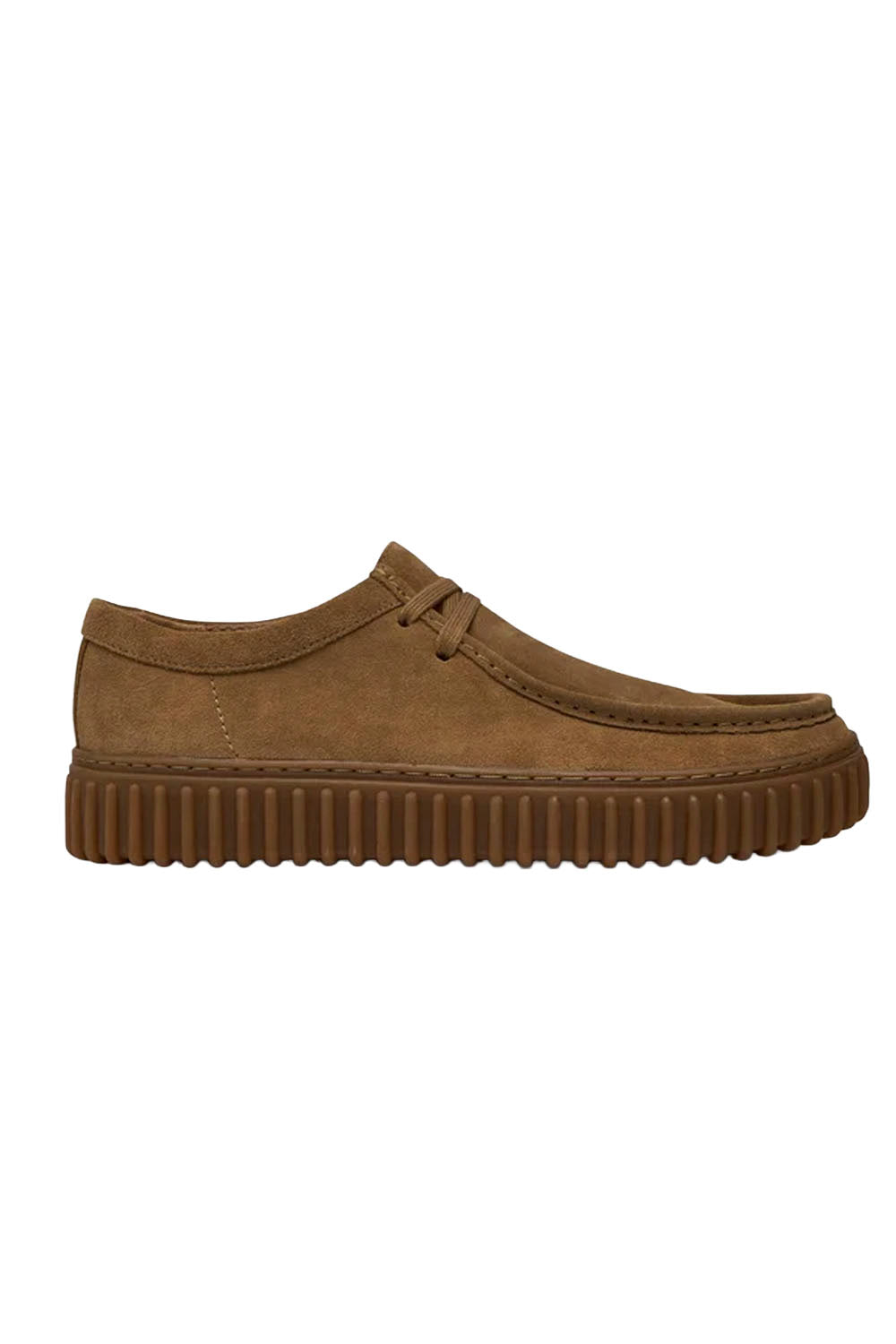 A pair of brown suede moc-toe platform creepers with a ribbed gum sole