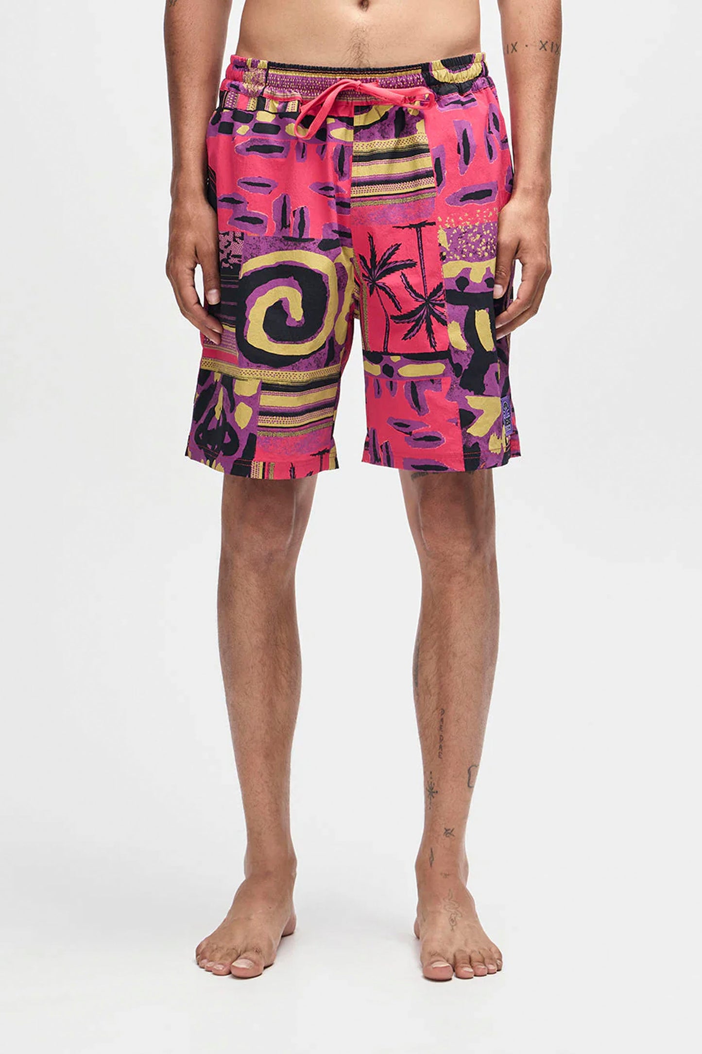 Deus Freamon Swim Short in Melon Red, men's surf lifestyle swimwear at Pukas Surf Shop