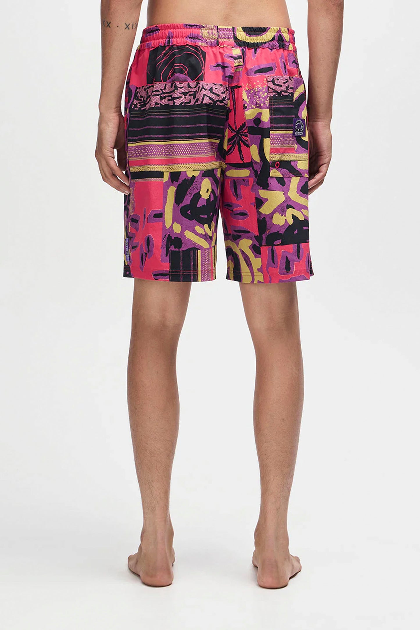 Deus Freamon Swim Short in Melon Red, men's surf lifestyle swimwear at Pukas Surf Shop