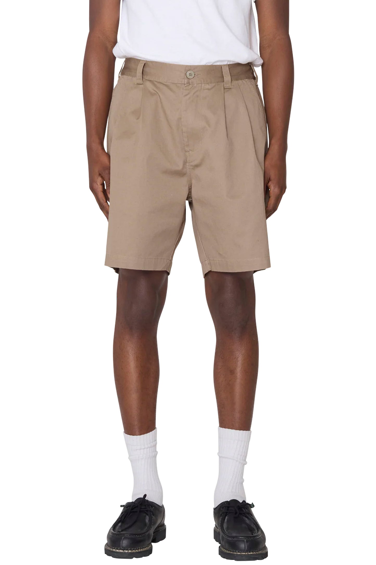Person wearing Beige Obey Foster Pleated shorts on a white background