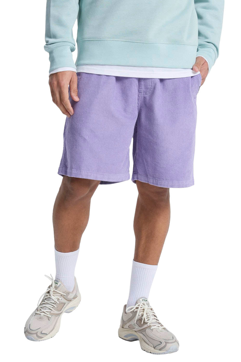 Person wearing light purple shorts and a light blue sweatshirt on a white background